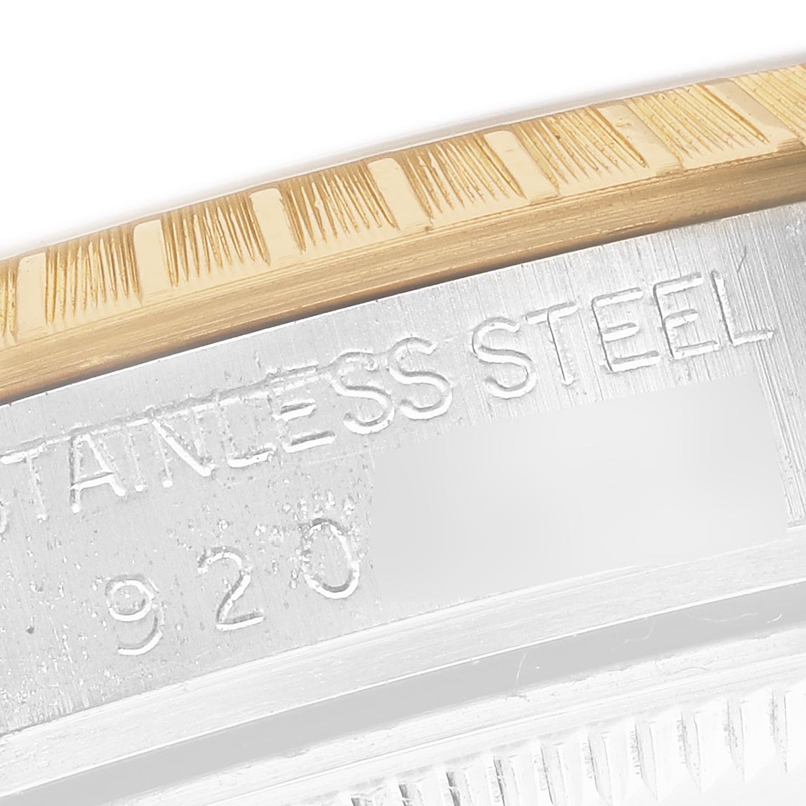 The image shows a close-up of the bezel and case back engraving on a Rolex Date 15053 Men
s Steel and Gold (two tone) Champagne Dial 15053 Men
s Steel and Gold (two tone) Champagne Dial watch.