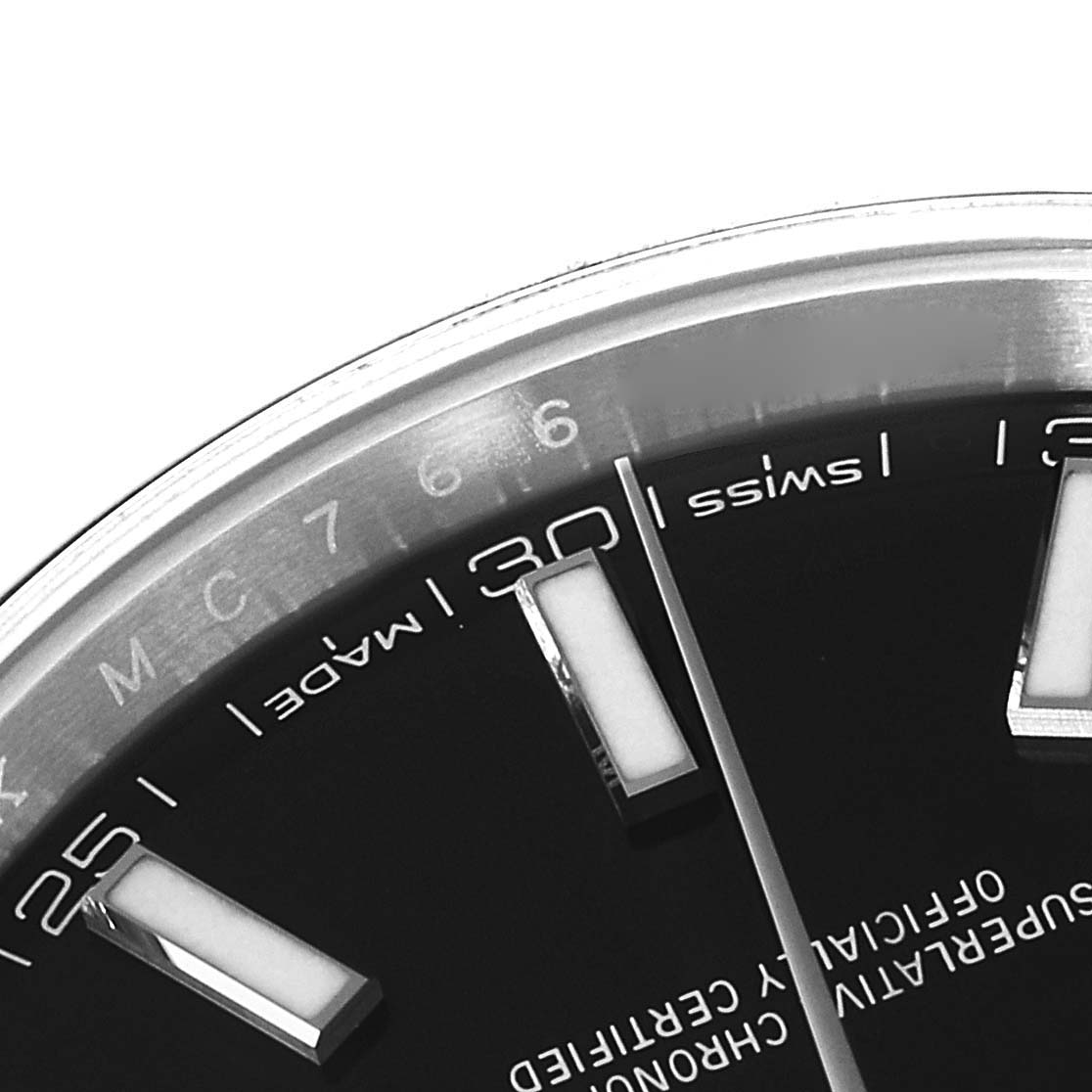 This image shows a close-up angle of the dial of a Rolex Datejust 41 126300 Men
s Stainless Steel Black Dial 126300 Men
s Stainless Steel Black Dial watch, highlighting the indices and part of the minute scale.