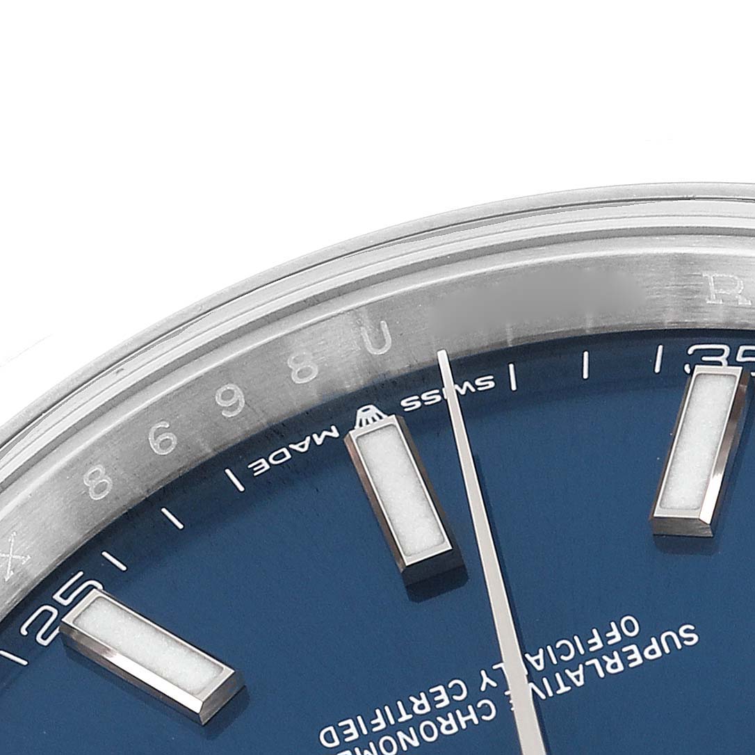 This image shows a close-up of the dial and partial bezel of the Rolex Datejust 41 126300 Men's Stainless Steel Blue Dial 126300 Men's Stainless Steel Blue Dial watch, highlighting the indices and text.