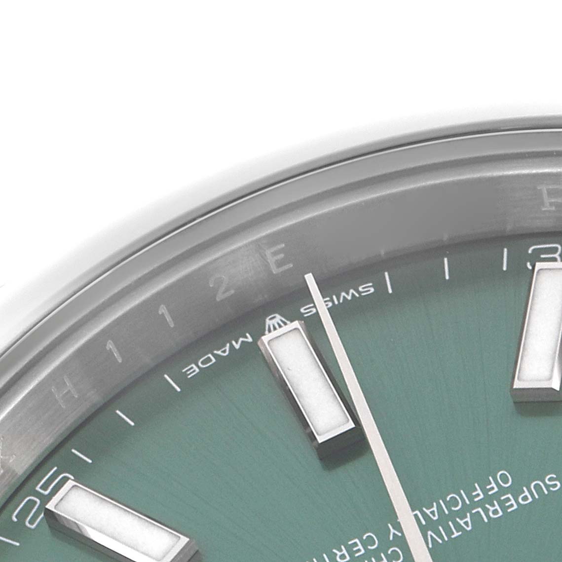 The image shows a close-up of the upper-right dial portion of a Rolex Datejust 41 126300 Men
s Stainless Steel Green Dial 126300 Men
s Stainless Steel Green Dial, focusing on the hour markers and second hand.