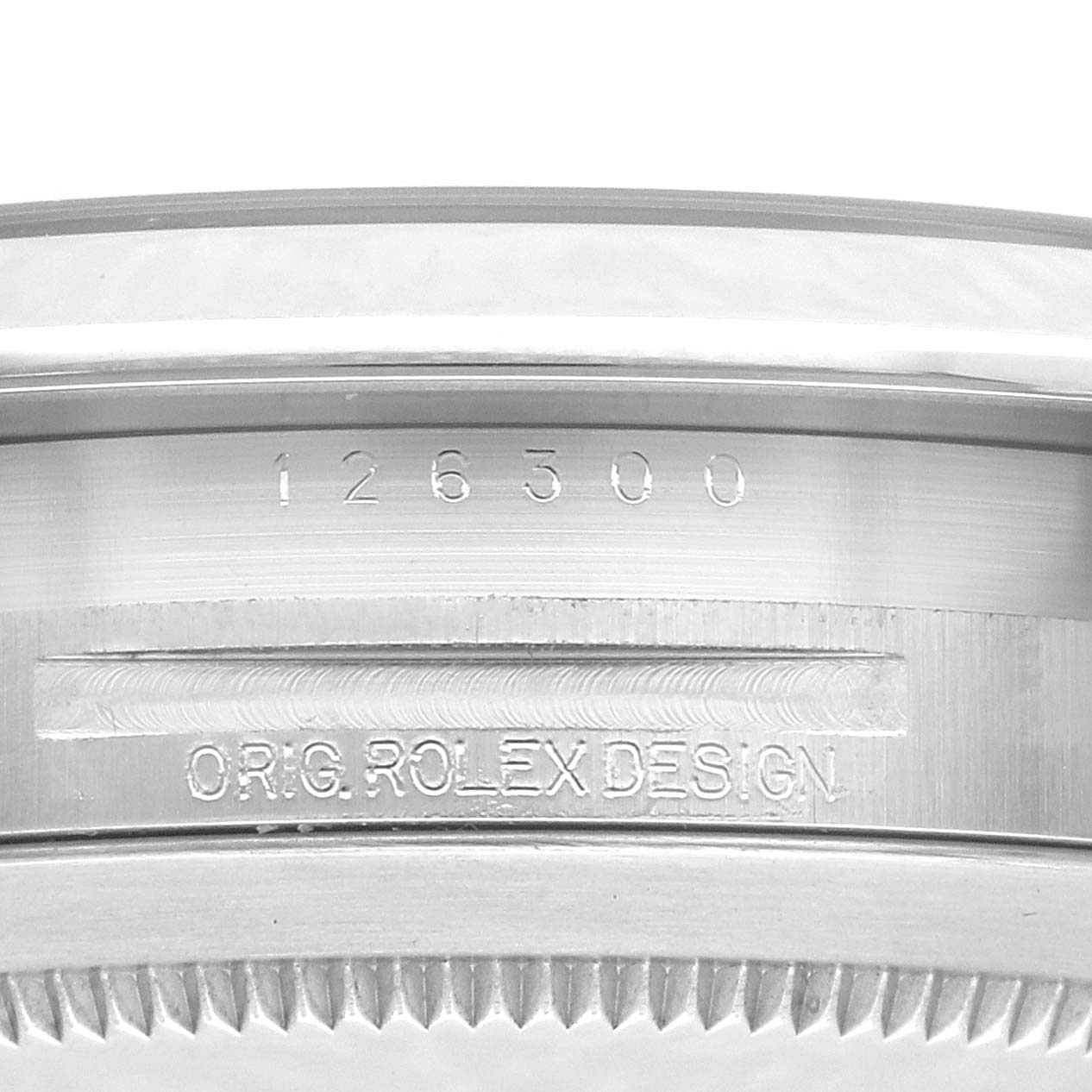 The image shows a close-up of the case side of a Rolex Datejust 41 126300 Men
s Stainless Steel Green Dial 126300 Men
s Stainless Steel Green Dial, highlighting the model number and "Orig. Rolex Design" engraving.