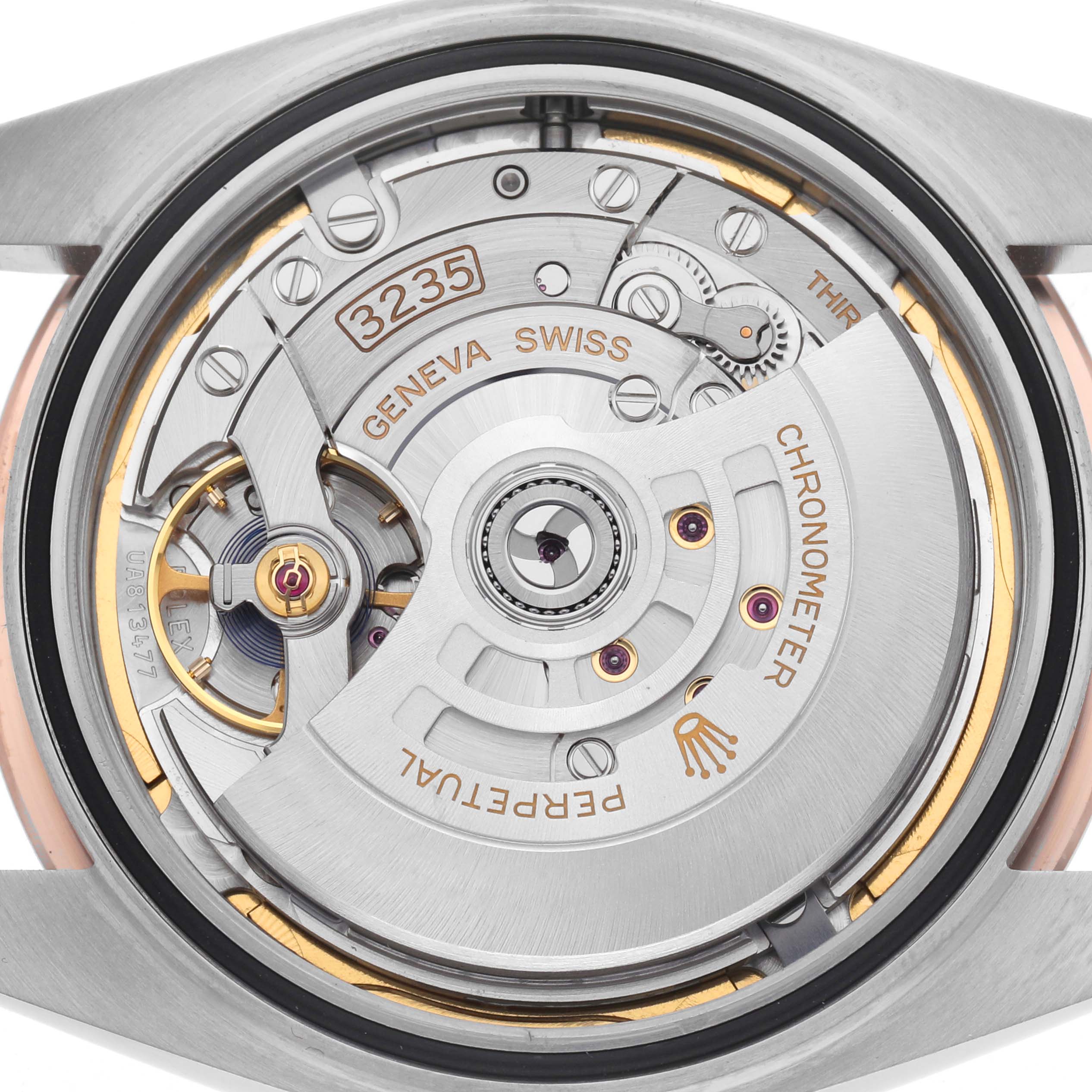 The image shows the movement of a Rolex Datejust 41 126331 Men
s Steel and Gold (two tone) Brown Dial 126331 Men
s Steel and Gold (two tone) Brown Dial from the back, highlighting the intricate mechanical parts.