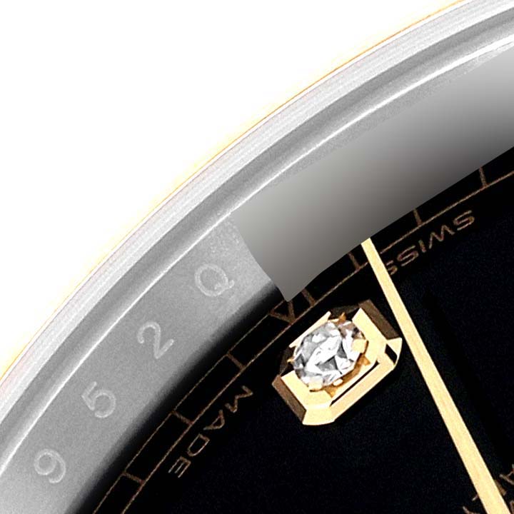 The image shows a close-up of the Rolex Datejust 41 126303 Men's Steel and Gold (two tone) Black Dial 126303 Men's Steel and Gold (two tone) Black Dial watch face, highlighting the bezel, part of the dial, and a diamond hour marker.