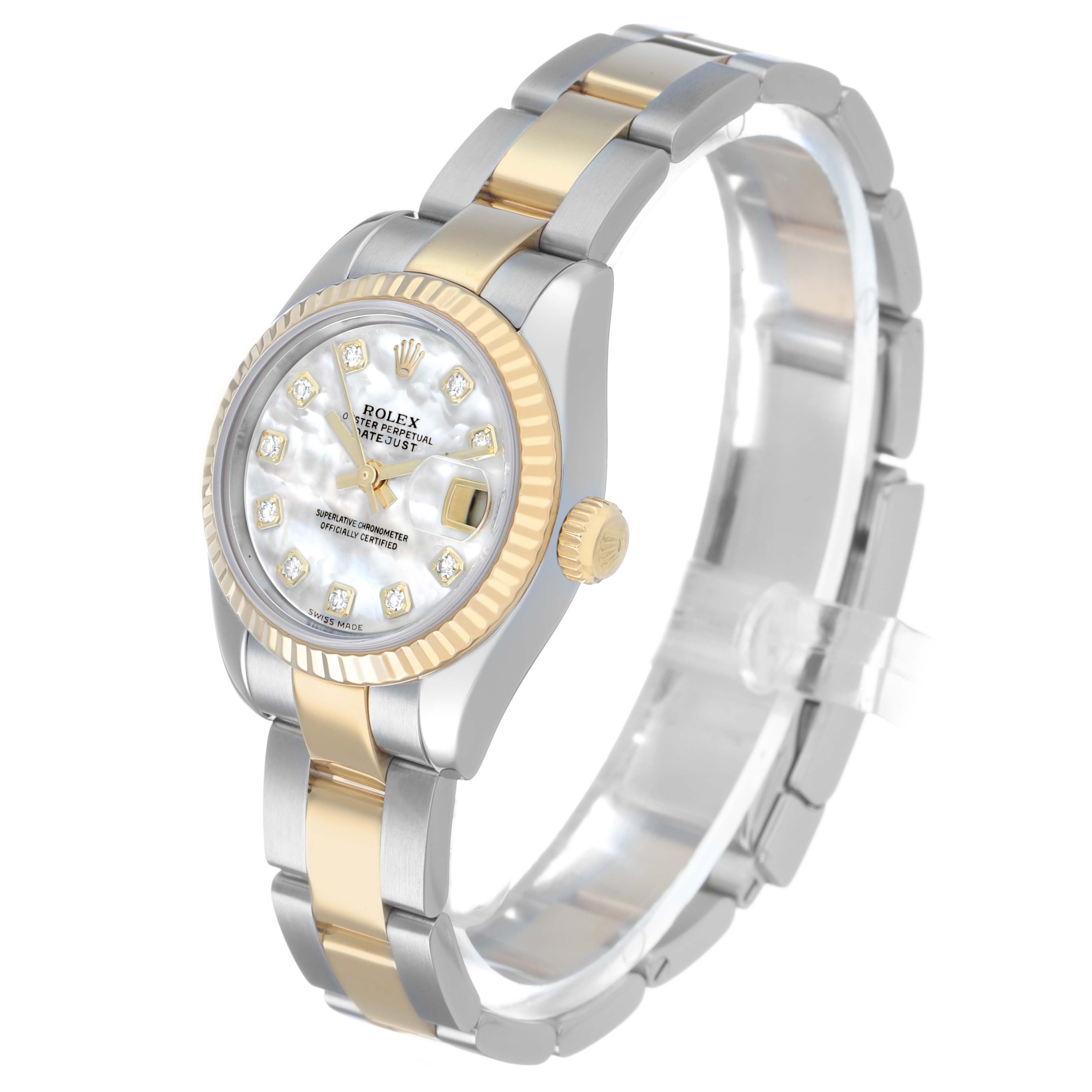 The Rolex Datejust 179173 Women's Steel and Gold (two tone) Mother of Pearl Dial watch is shown at a three-quarter angle, highlighting its mother-of-pearl dial, fluted bezel, and two-tone bracelet.
