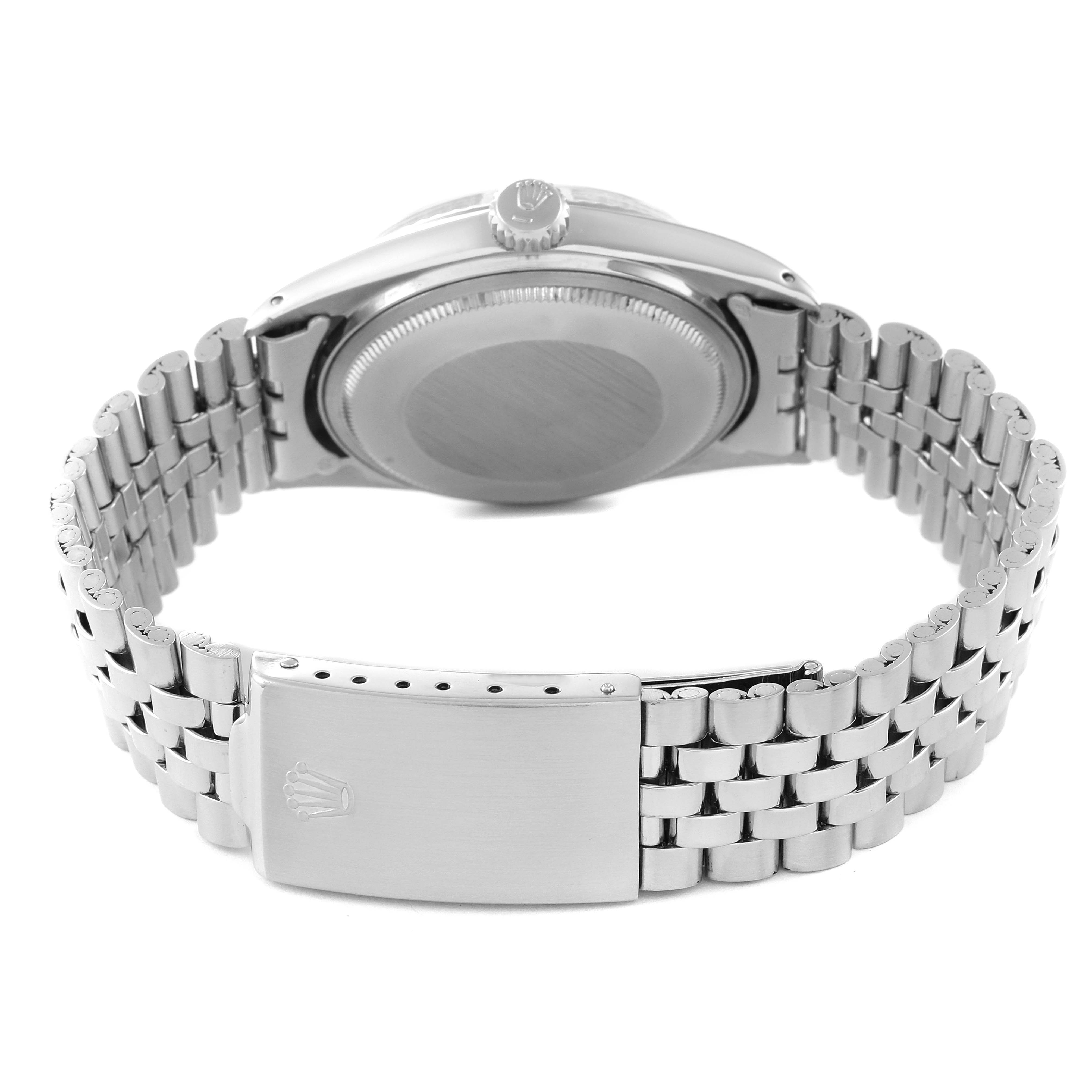 The image shows the back case and metal bracelet clasp of a Vintage Collection model by Rolex, viewed from the rear.