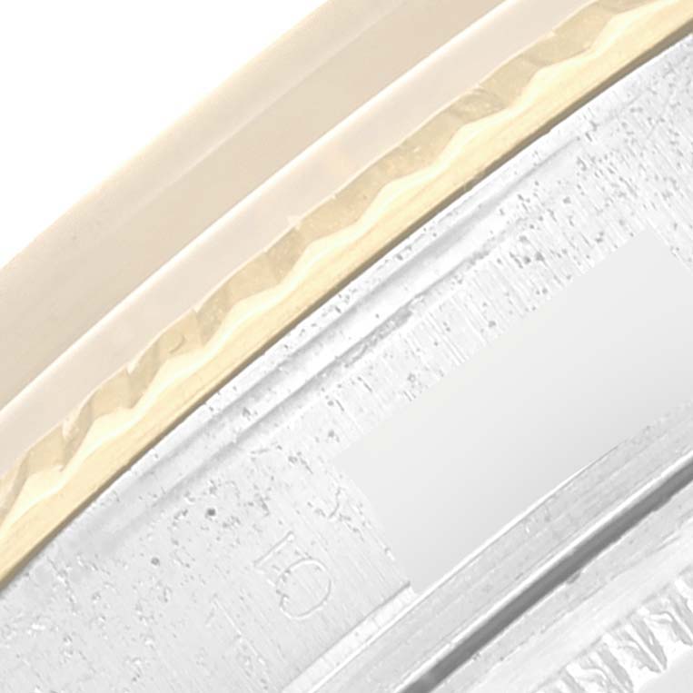 The image shows a close-up of the Rolex Vintage Collection 1601 Men's Steel and Gold (two tone) Black Dial 1601 Men's Steel and Gold (two tone) Black Dial watch's bezel and part of the outer ring.