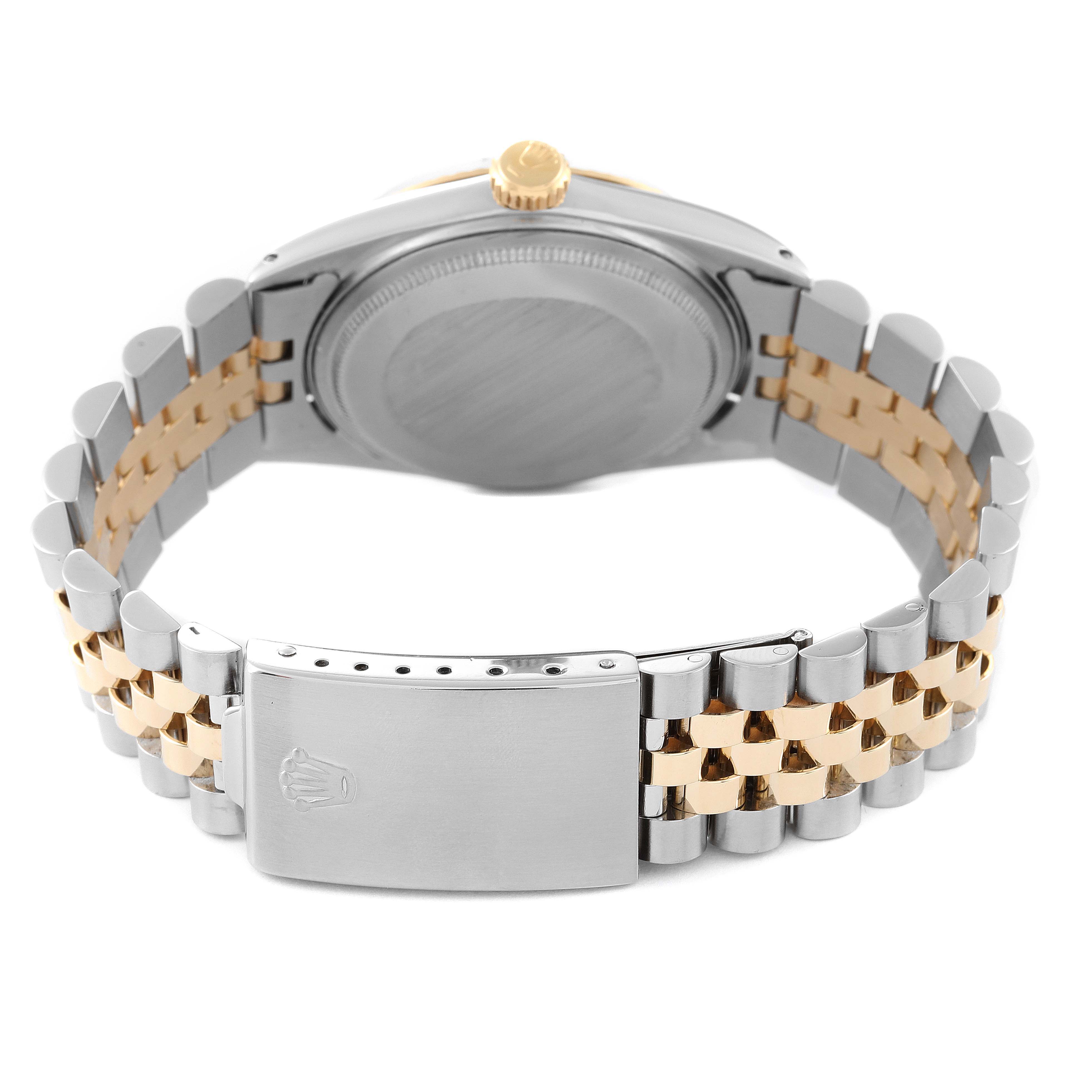 This image shows the back view of a Rolex Vintage Collection 1601 Men's Steel and Gold (two tone) Black Dial 1601 Men's Steel and Gold (two tone) Black Dial watch, highlighting its case back and two-tone bracelet with clasp.