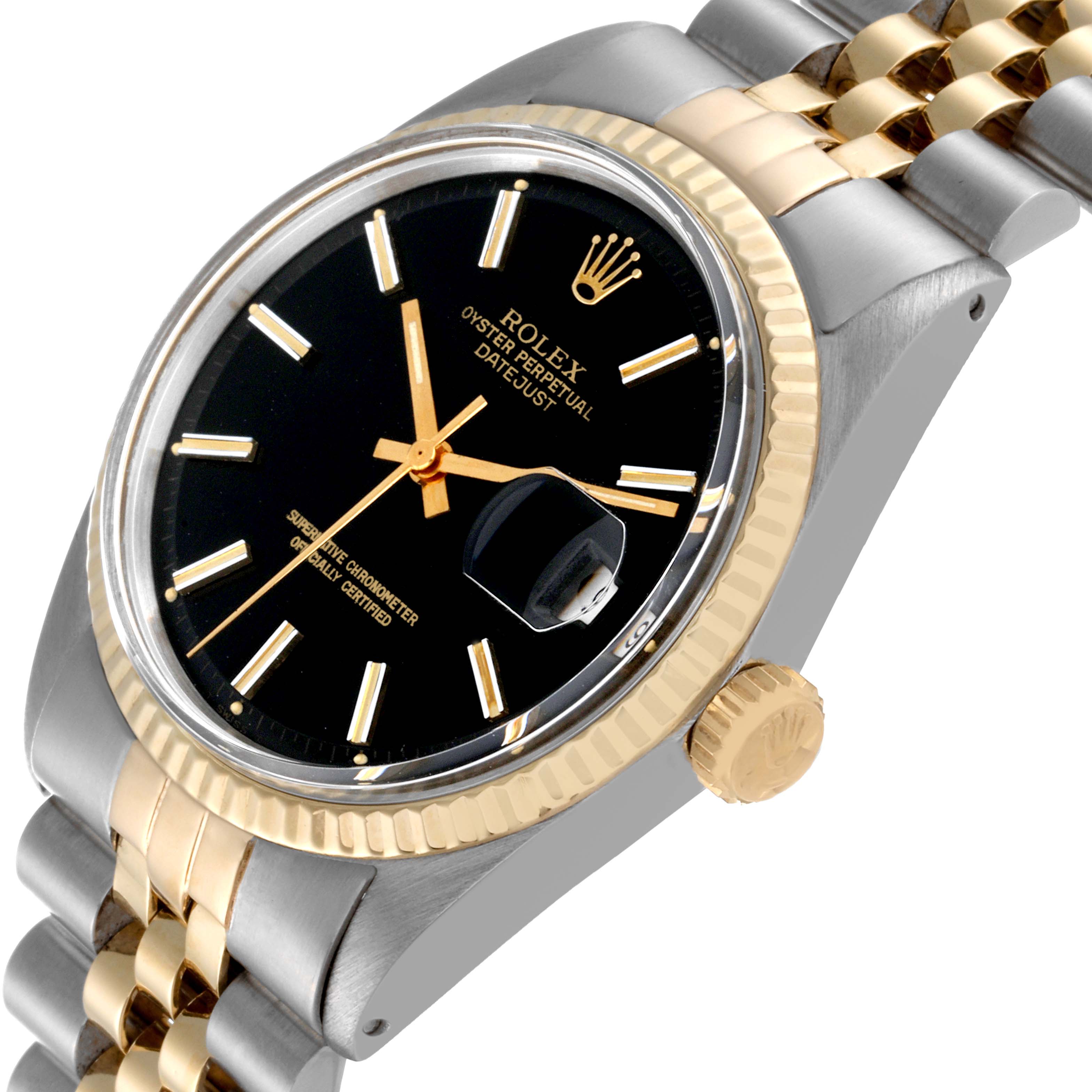The image shows a close-up angle of the Rolex Vintage Collection 1601 Men's Steel and Gold (two tone) Black Dial 1601 Men's Steel and Gold (two tone) Black Dial Datejust, highlighting the dial, crown, and part of the bracelet.