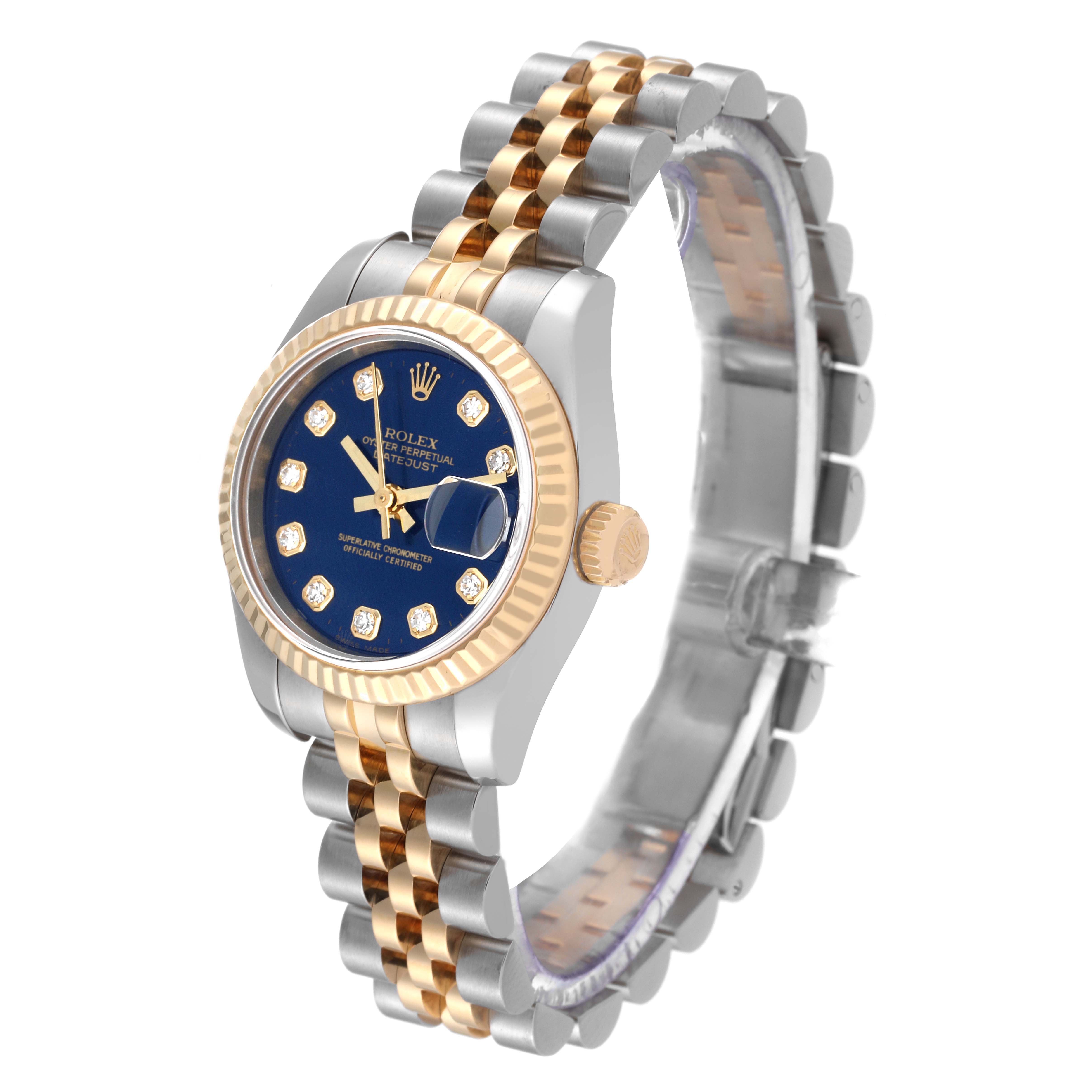 This image shows a Rolex Datejust 179173 Women's Steel and Gold (two tone) Blue Dial 179173 Women's Steel and Gold (two tone) Blue Dial watch at a slight side angle, highlighting its blue dial, fluted bezel, and two-tone bracelet.