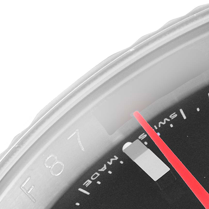 This close-up image of a Rolex Turn-o-Graph 116264 Men
s Stainless Steel Black Dial 116264 Men
s Stainless Steel Black Dial watch shows the bezel with markers and part of the dial with the second hand.