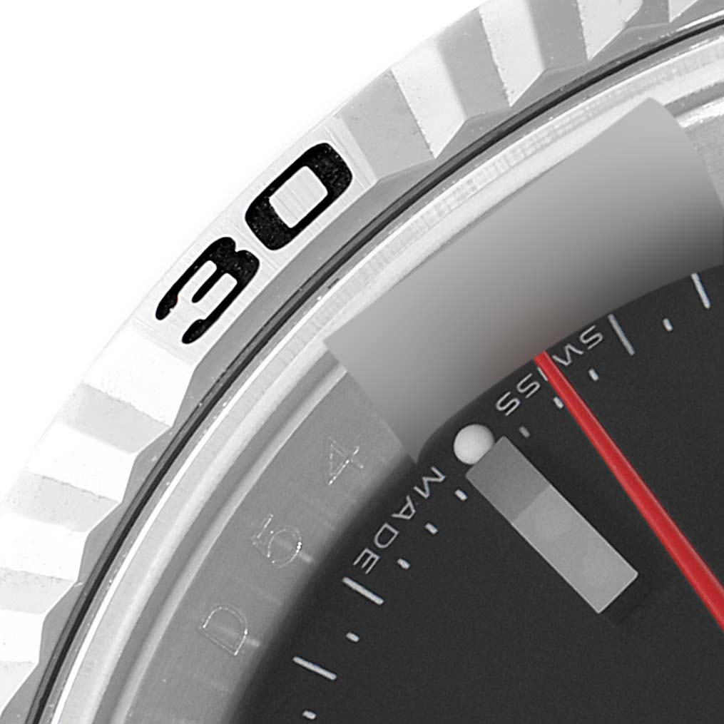 The image shows a close-up of the bezel and part of the dial of a Rolex Turn-o-Graph 116264 Men
s Stainless Steel Black Dial 116264 Men
s Stainless Steel Black Dial watch.