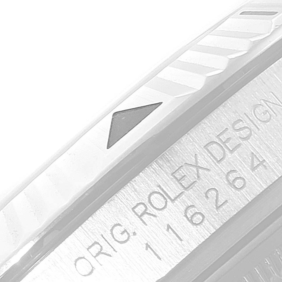 This image shows a close-up of the bezel and engraved serial number on a Rolex Turn-o-Graph 116264 Men
s Stainless Steel Black Dial 116264 Men
s Stainless Steel Black Dial watch.