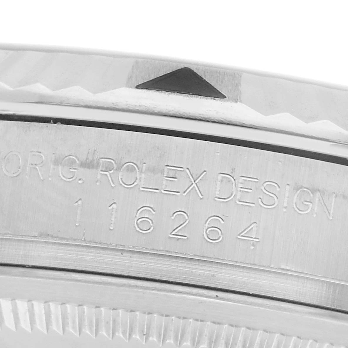 The image shows a close-up of the engraved bezel and edge of a Rolex Turn-o-Graph 116264 Men
s Stainless Steel Black Dial 116264 Men
s Stainless Steel Black Dial watch, highlighting the model number.