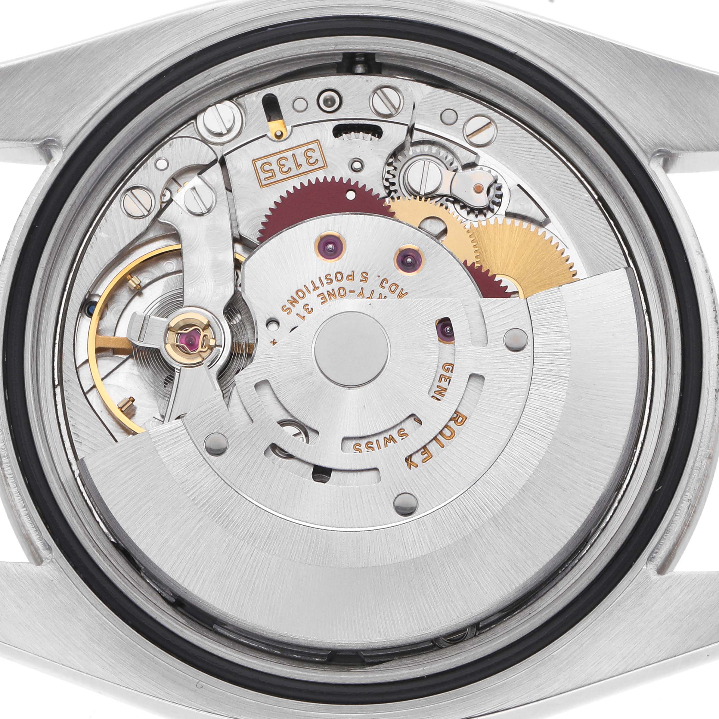 The image shows the back view of a Rolex Turn-o-Graph 116264 Men
s Stainless Steel Black Dial 116264 Men
s Stainless Steel Black Dial watch, focusing on its mechanical movement and gears.