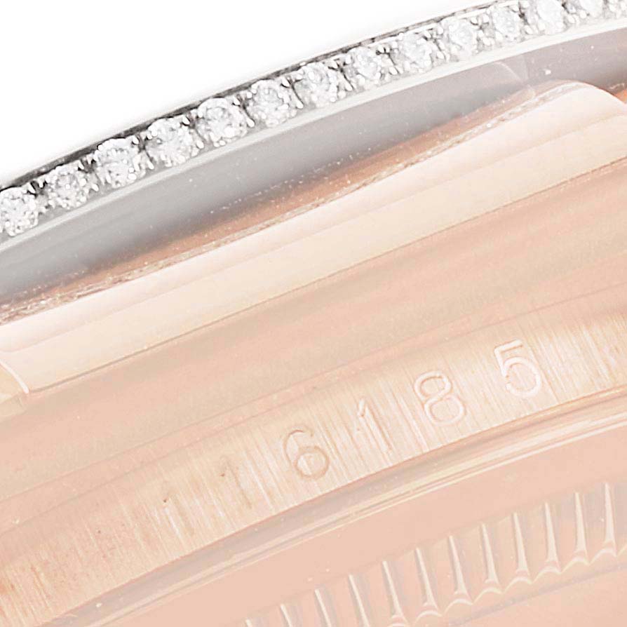This close-up image shows the diamond-studded bezel and part of the case with engraved numbers on the Rolex President 116185 Men's Rose Gold Black Dial 116185 Men's Rose Gold Black Dial model watch.