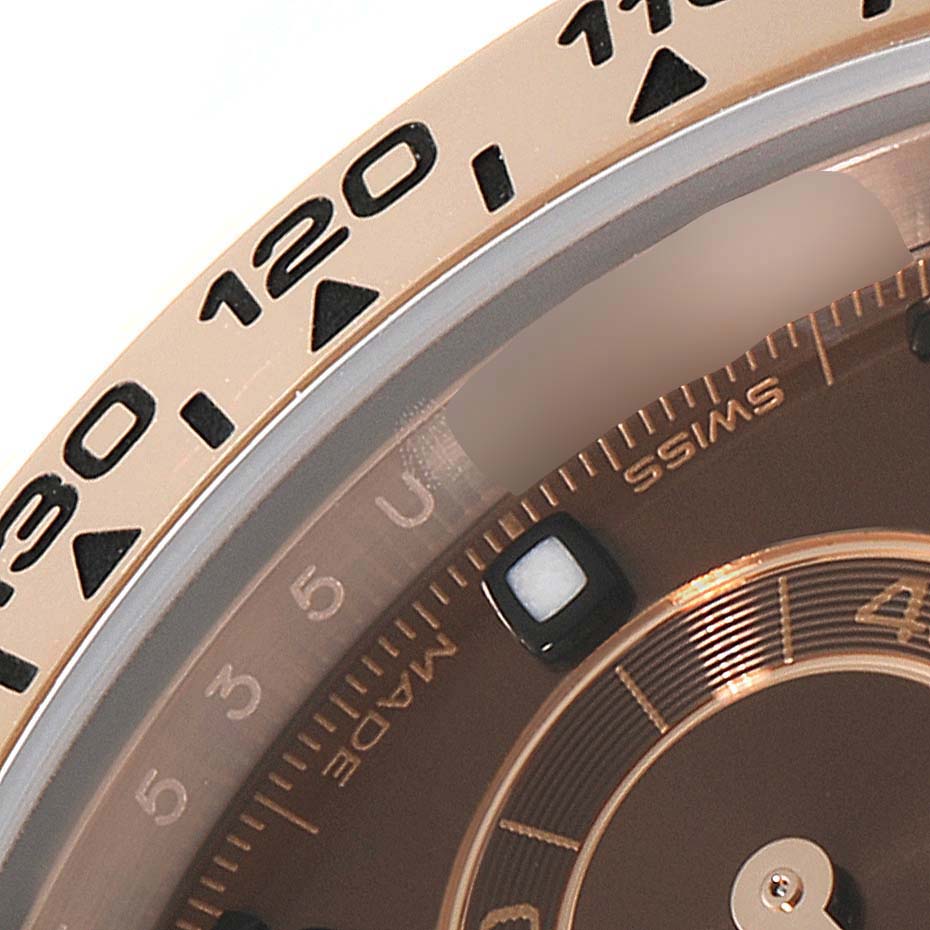 This close-up image shows the bezel and partial dial of a Rolex Daytona 116505 Men
s Rose Gold Brown Dial 116505 Men
s Rose Gold Brown Dial watch.
