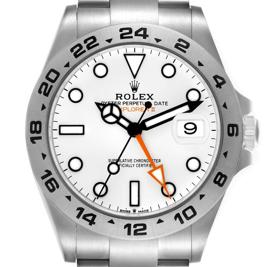 The image shows a front view of a Rolex Explorer II watch, displaying the dial, bezel, hands, and part of the bracelet.