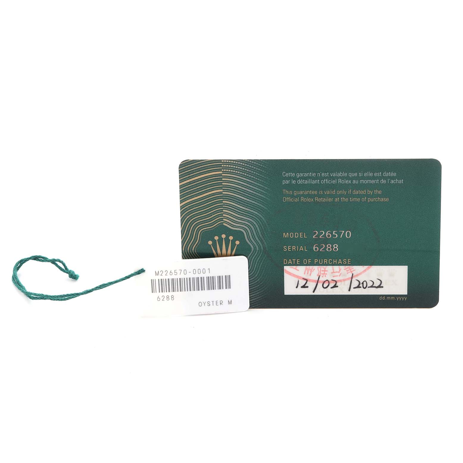 The image shows a Rolex Explorer 226570 Men
s Stainless Steel White Dial 226570 Men
s Stainless Steel White Dial model 226570 warranty card and tag from a front angle.