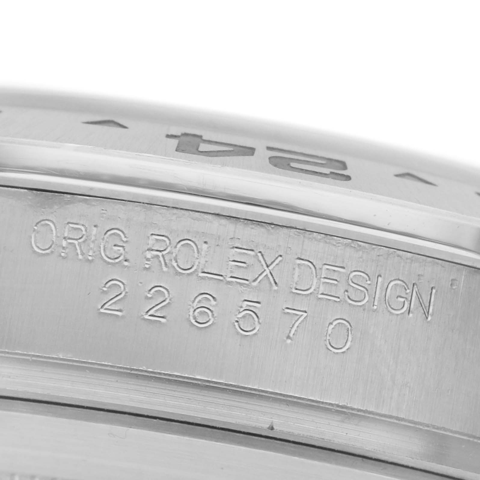 The image shows a close-up of the side of a Rolex Explorer 226570 Men
s Stainless Steel White Dial 226570 Men
s Stainless Steel White Dial watch case, featuring engraved text with the model number.