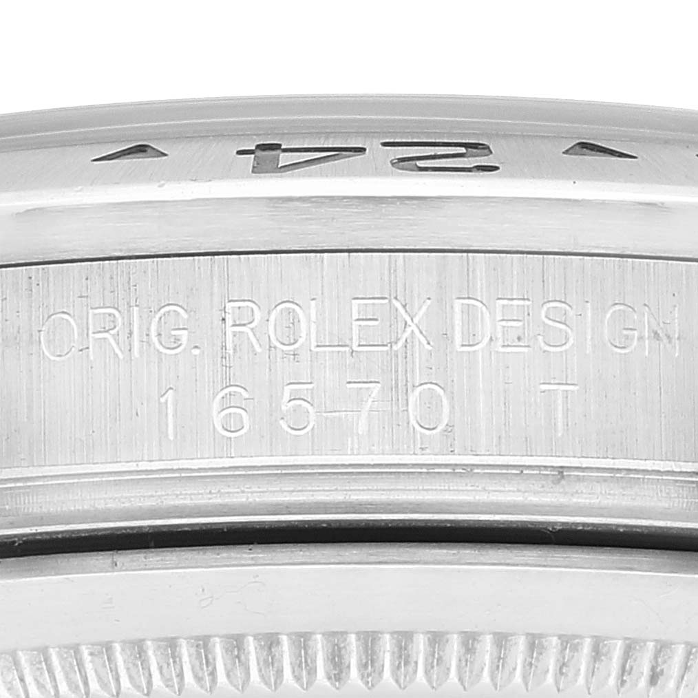 The image shows a close-up of the side of the Rolex Explorer 16570T Men
s Stainless Steel White Dial 16570T Men
s Stainless Steel White Dial, specifically the engraved model number "16570" and some design details.