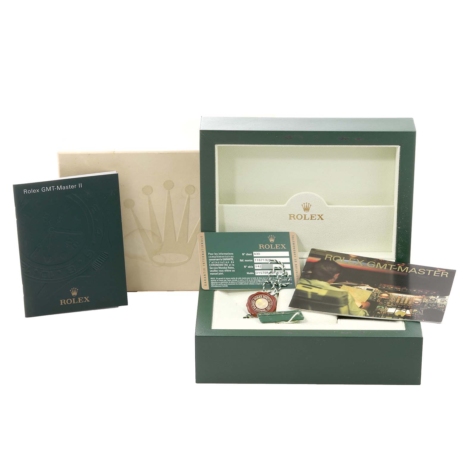 The image shows the packaging, manual, warranty card, and tags for a Rolex GMT-Master 116713 Men's Steel and Gold (two tone) Black Dial 116713 Men's Steel and Gold (two tone) Black Dial watch from a frontal angle.