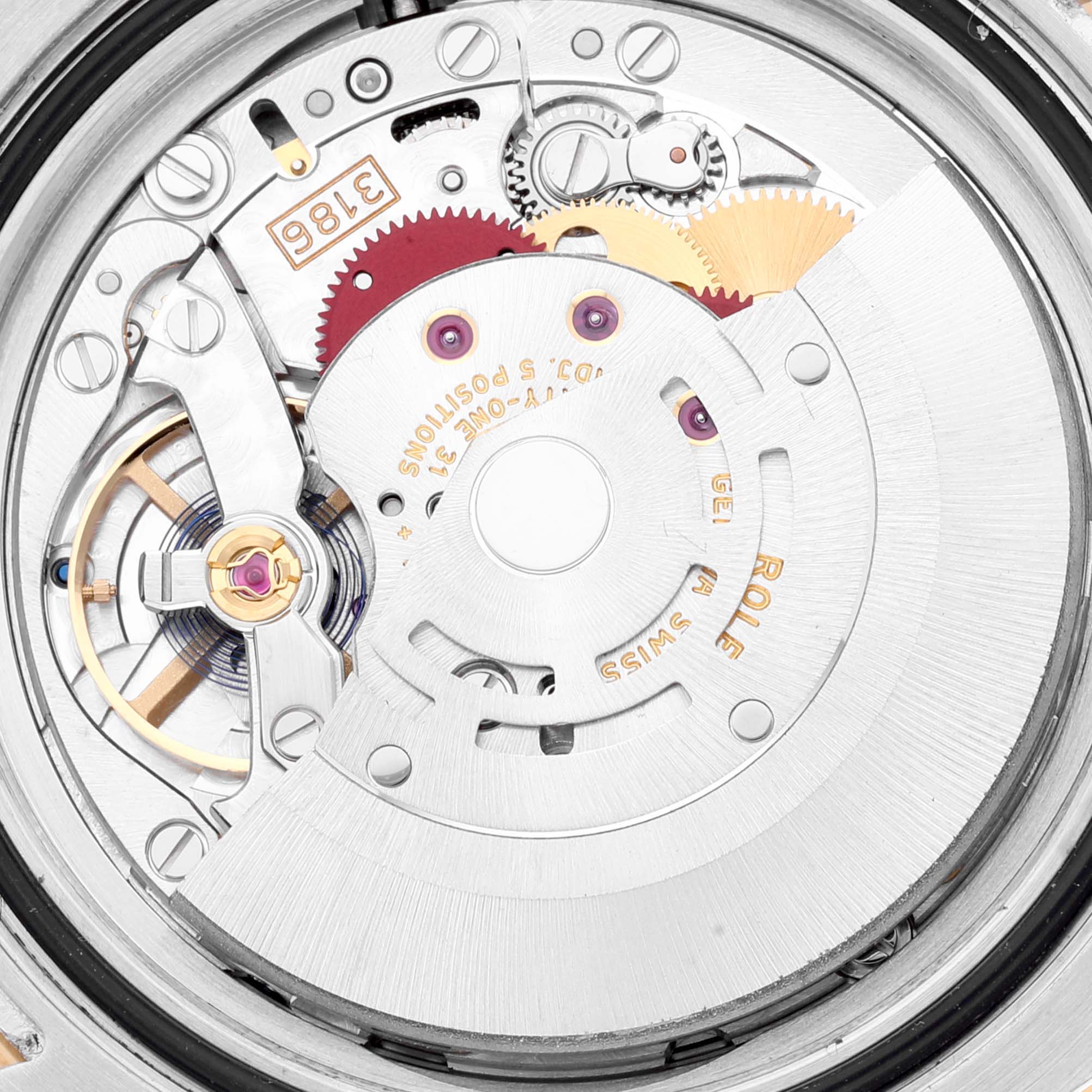 This image shows an up-close view of the movement mechanism inside a Rolex GMT-Master 116713 Men's Steel and Gold (two tone) Black Dial 116713 Men's Steel and Gold (two tone) Black Dial watch.