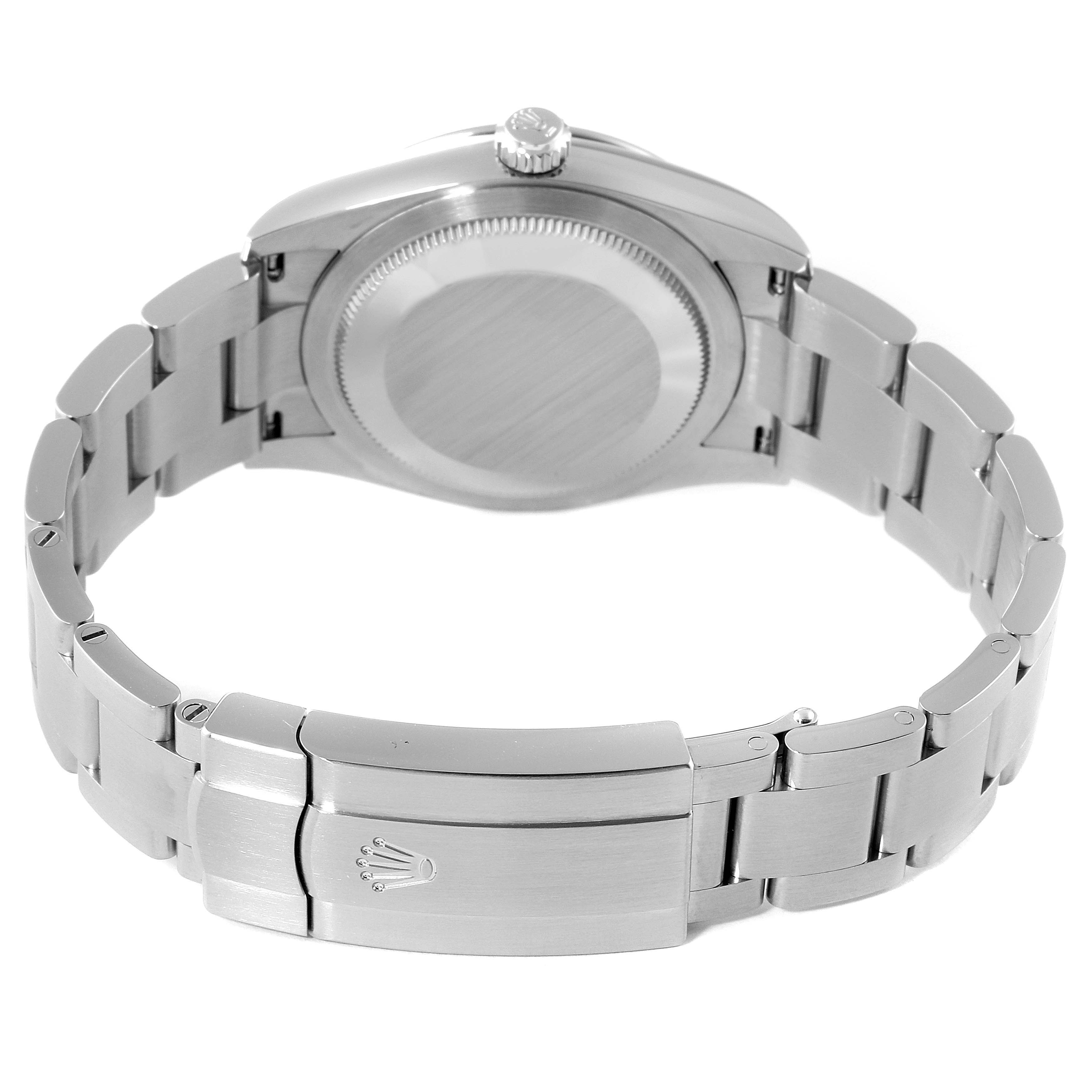 This image shows the back of a Rolex Date 124200 Men's Stainless Steel Silver Dial 124200 Men's Stainless Steel Silver Dial watch, highlighting its case back, crown, and metal bracelet with clasp.