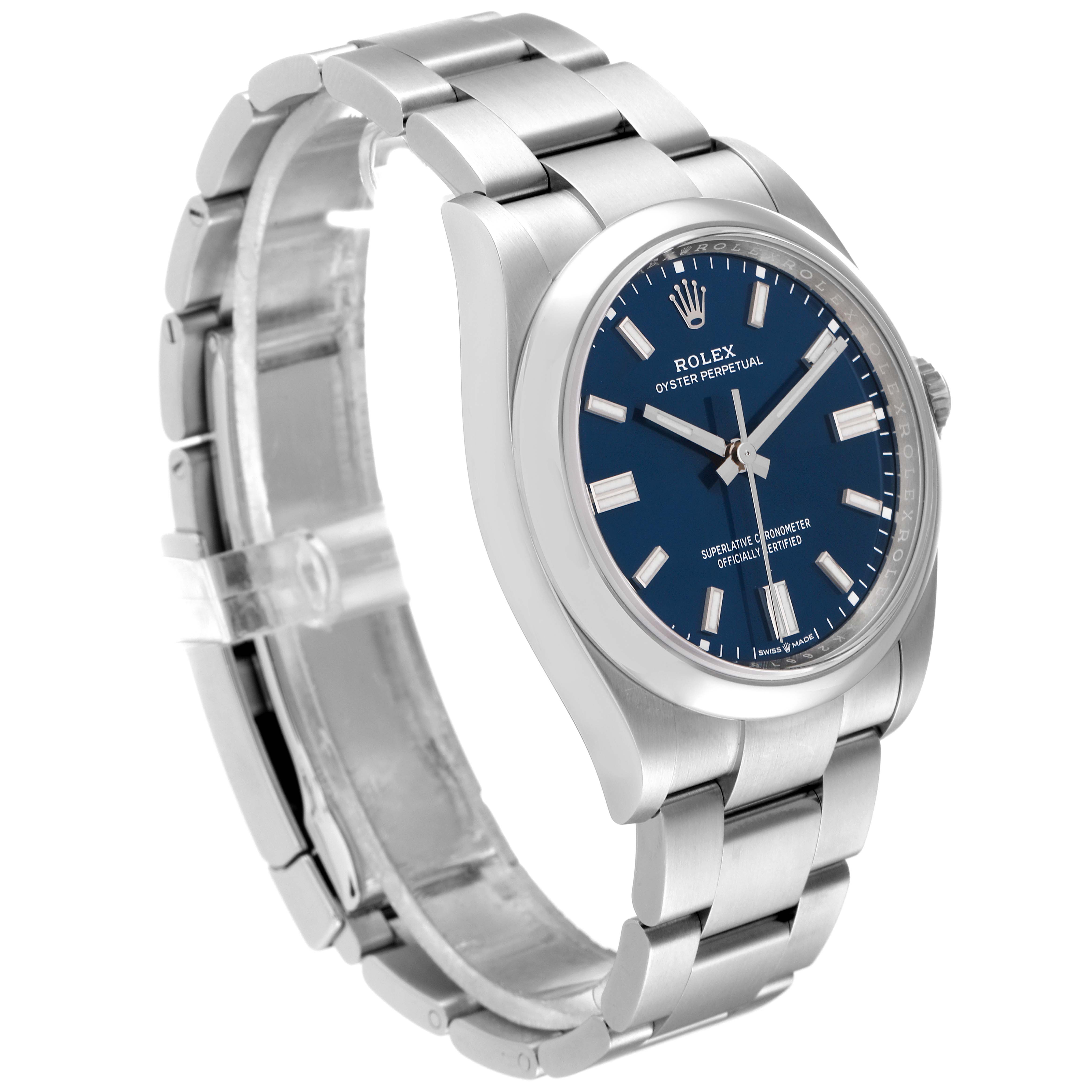 The Rolex Oyster Perpetual 126000 Men's Stainless Steel Blue Dial 126000 Men's Stainless Steel Blue Dial watch is angled to show its blue dial, stainless steel case, bracelet, and clasp.