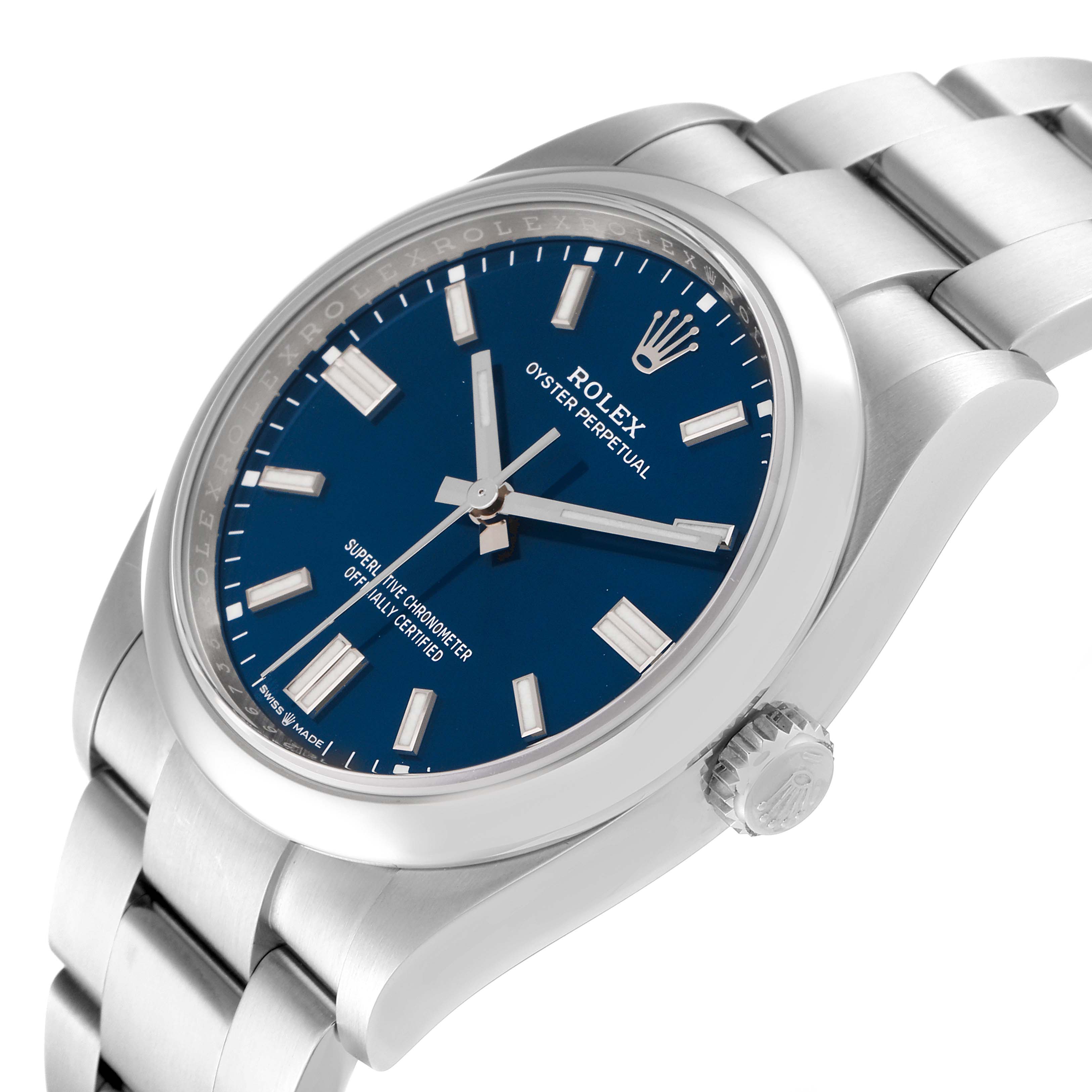 The image shows a side view of a Rolex Oyster Perpetual 126000 Men's Stainless Steel Blue Dial 126000 Men's Stainless Steel Blue Dial watch, highlighting the face, case, bracelet, and crown.