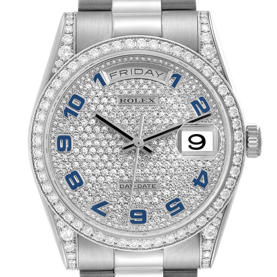 The Rolex President model watch is shown from a front angle, highlighting the diamond-encrusted bezel, dial, and day-date feature.
