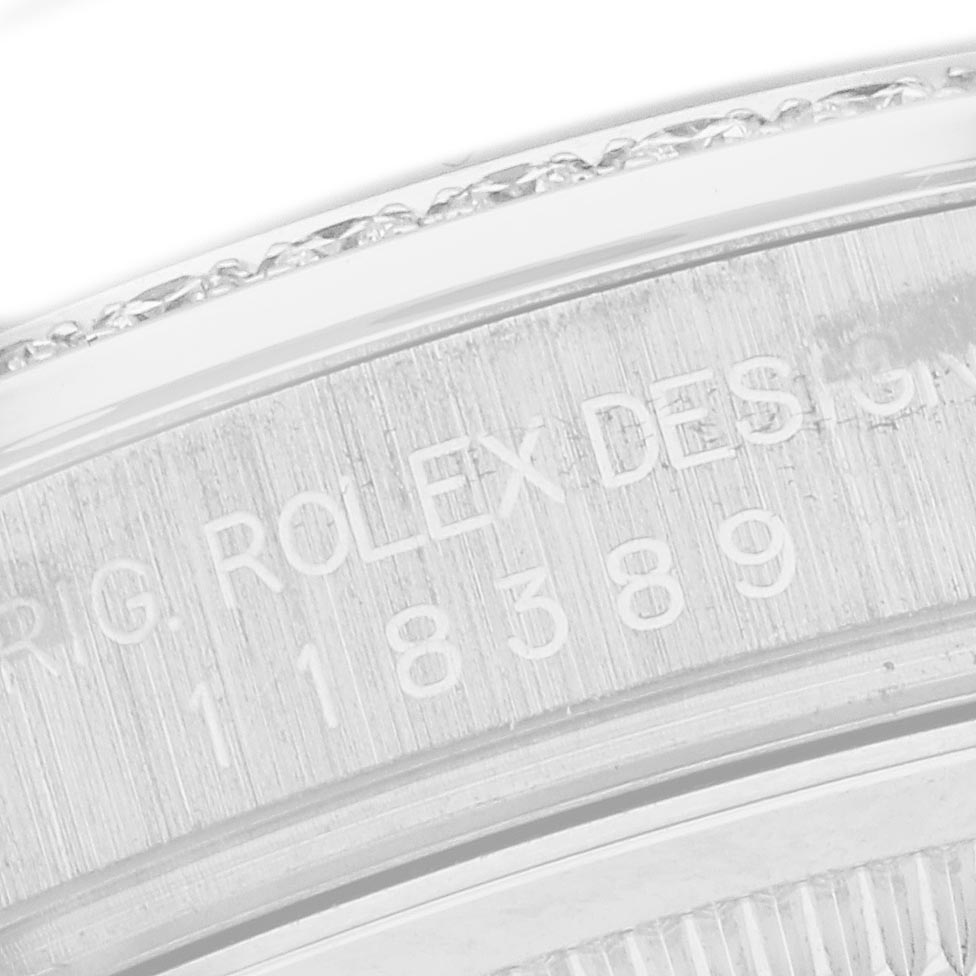 The image shows an engraved side view of the bezel and case of a Rolex President 118389 Men
s White Gold White Dial 118389 Men
s White Gold White Dial watch.