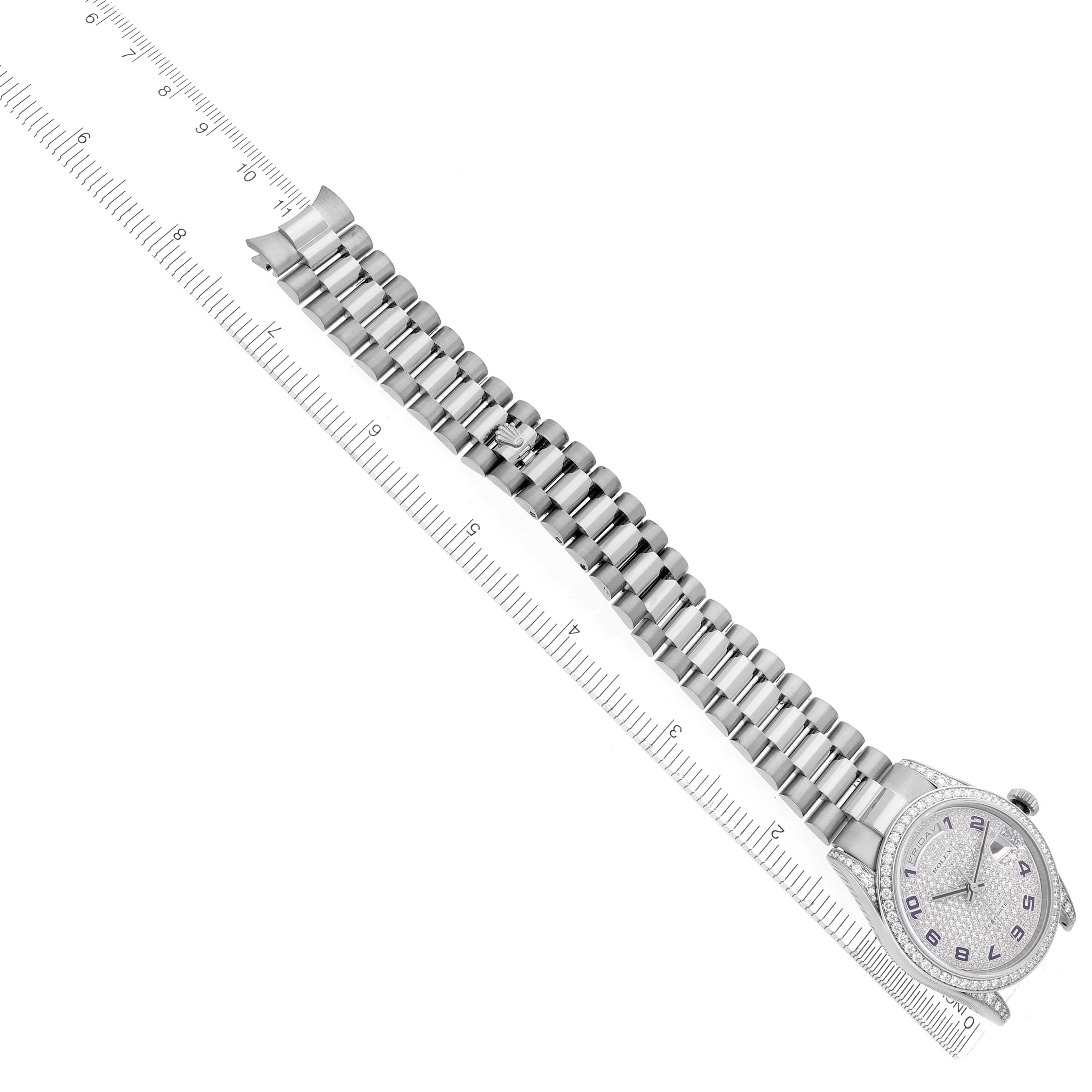 The Rolex President 118389 Men
s White Gold White Dial 118389 Men
s White Gold White Dial model is shown from a top-down angle, featuring its entire bracelet and dial next to a ruler for scale.