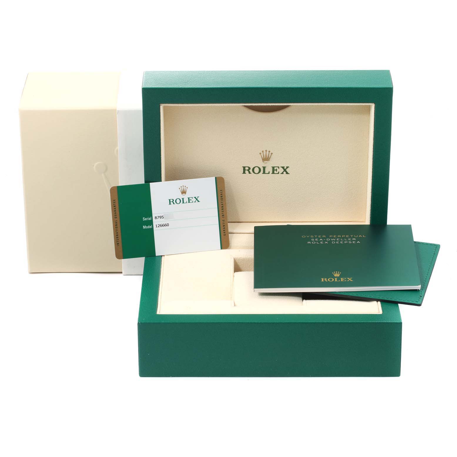 The image shows the box, warranty card, and documents for a Rolex Sea-Dweller 126660 Men
s Stainless Steel Blue Dial 126660 Men
s Stainless Steel Blue Dial watch, displaying the interior and packaging.