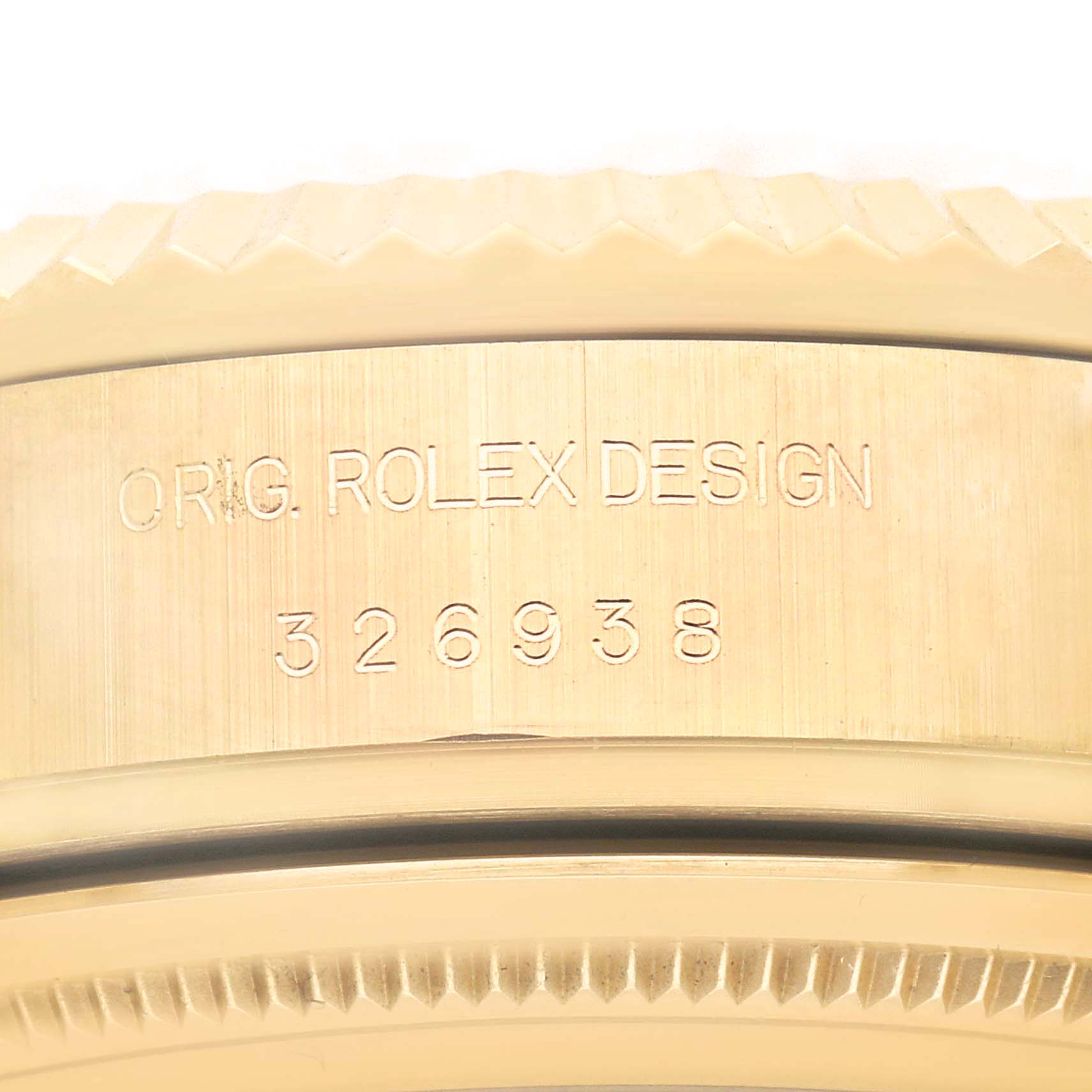 The image shows a close-up of the bezel and serial engraving on a Rolex Sky-Dweller 326938 Men
s Yellow Gold Black Dial 326938 Men
s Yellow Gold Black Dial watch.