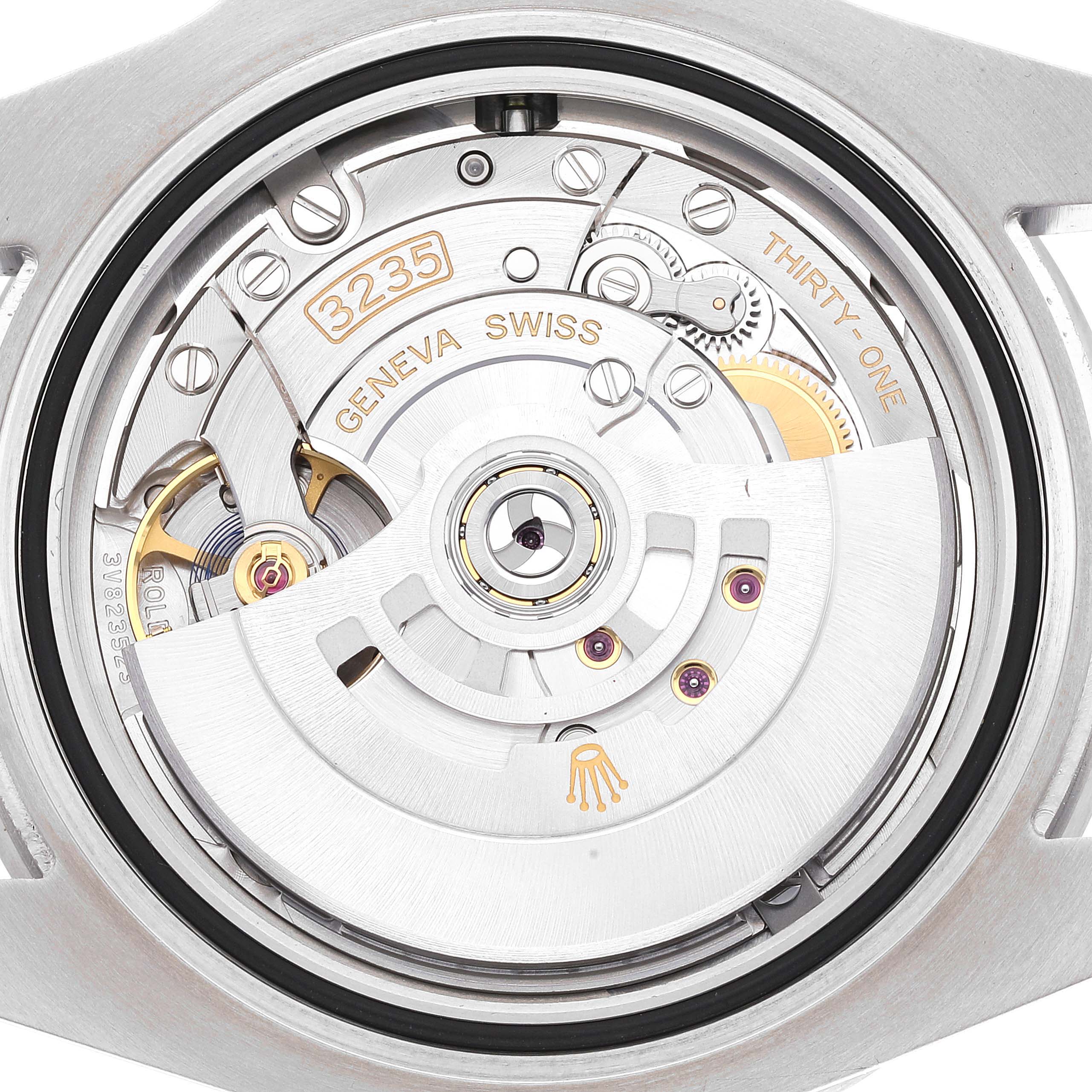 This image shows the back view of the Rolex Submariner 126610 Men
s Stainless Steel Black Dial 126610 Men
s Stainless Steel Black Dial, displaying its 3235 movement and internal mechanics.