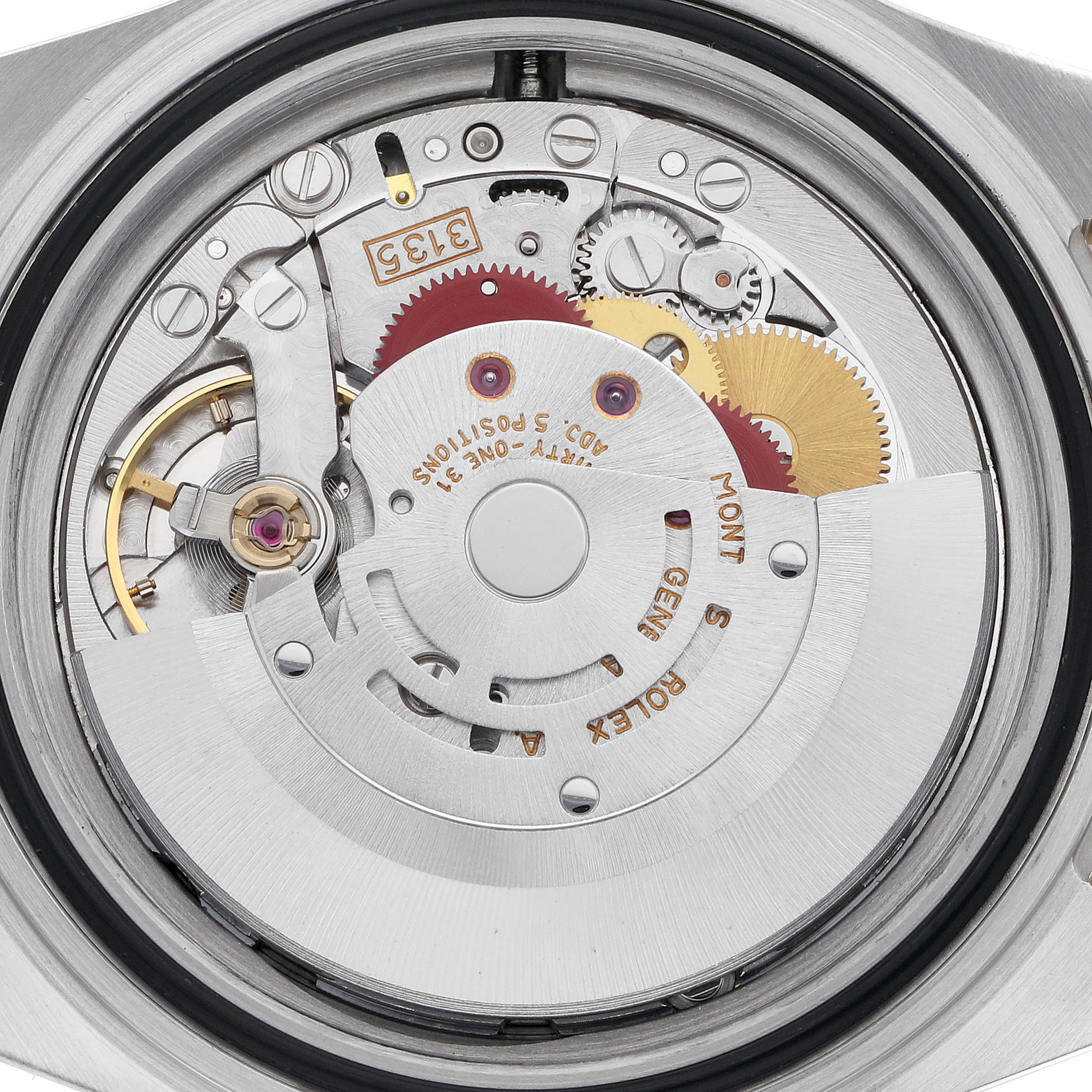The image shows the movement of a Rolex Submariner 16613 Men
s Steel and Gold (two tone) Champagne Dial 16613 Men
s Steel and Gold (two tone) Champagne Dial watch, viewed from the back, highlighting gears and mechanical components.