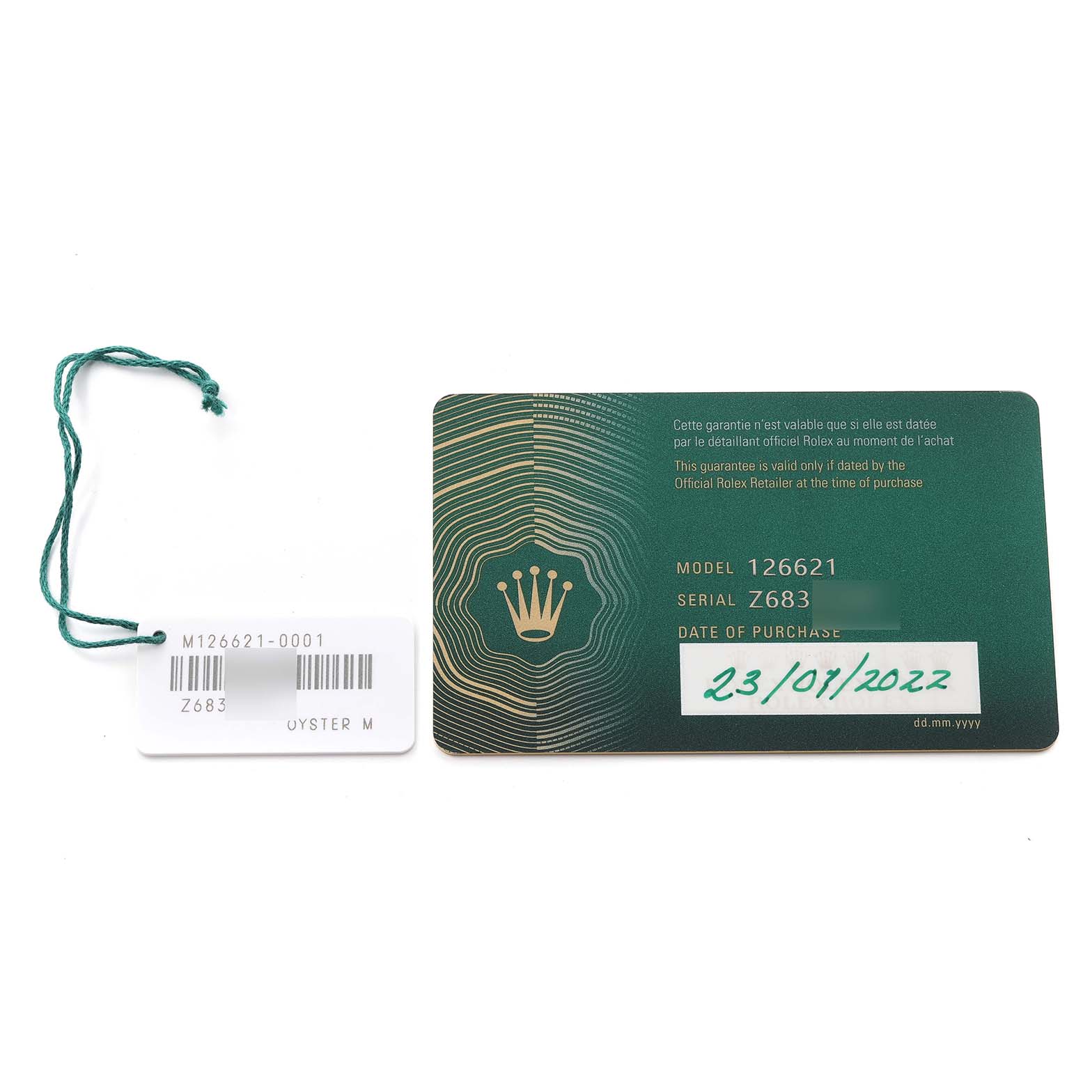 This image shows the warranty card and tag for a Rolex Yacht-Master 126621 Men's Steel and Gold (two tone) Brown Dial 126621 Men's Steel and Gold (two tone) Brown Dial model 126621.