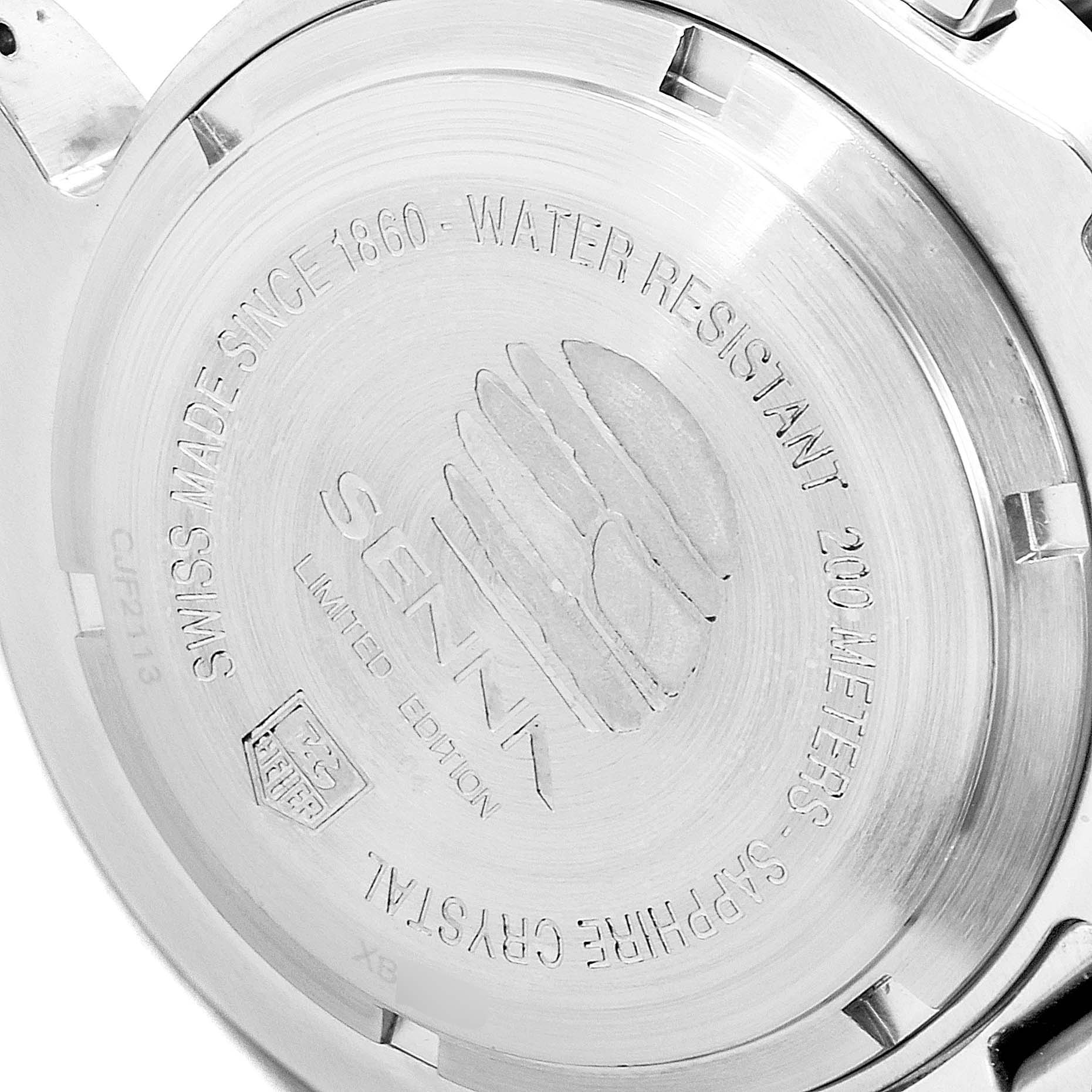 The image shows the back case of a Tag Heuer Link model watch, displaying engraving details and specifications.