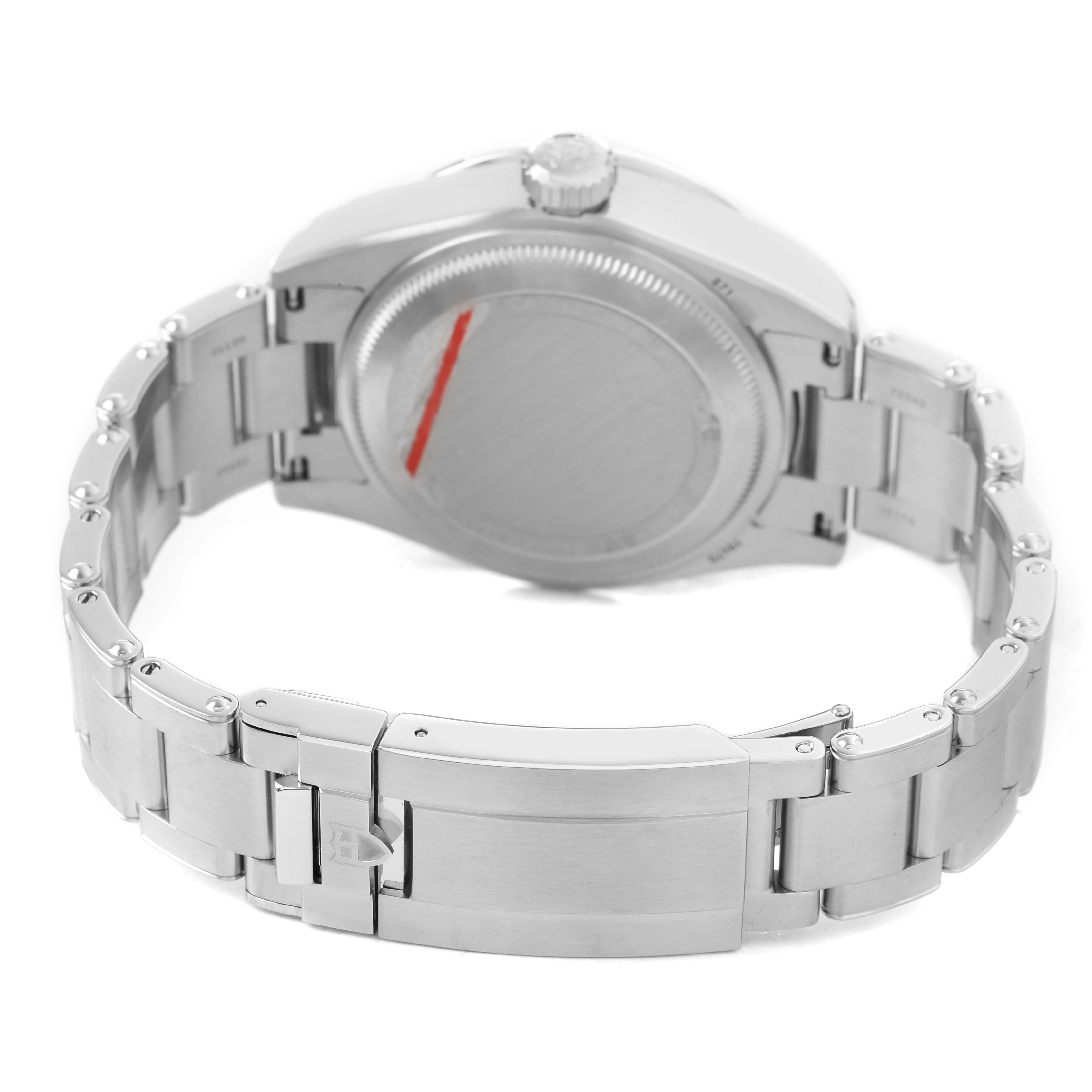 The image shows the back of the Tudor Heritage Black Bay M79470-0004 Men's Stainless Steel White Dial watch, highlighting the case back, crown, and metal bracelet with clasp.