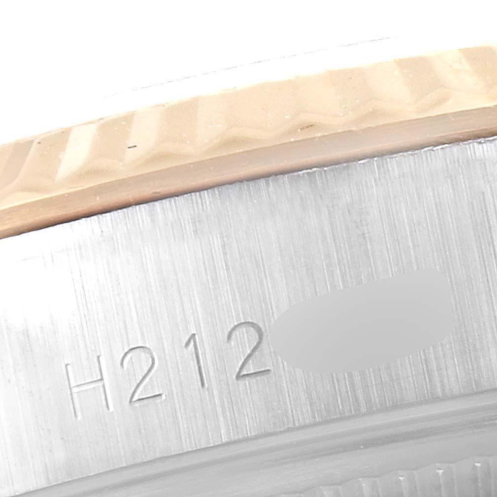 This image shows a close-up of the bezel and part of the case of a Tudor Princess 92413 Women's Steel and Gold (two tone) Champagne Dial 92413 Women's Steel and Gold (two tone) Champagne Dial watch, highlighting the engraved numbers.