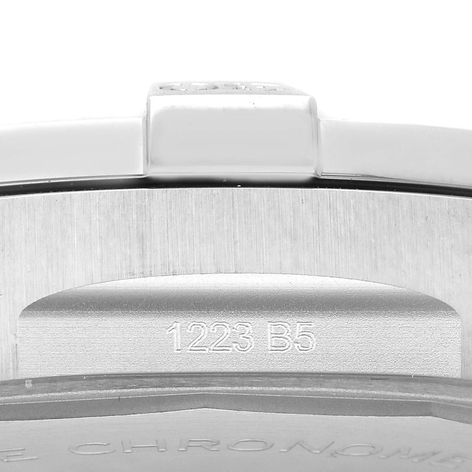 The image shows a close-up of the side of a Breitling Avenger A32395 Men's Stainless Steel Blue Dial A32395 Men's Stainless Steel Blue Dial watch, highlighting the case and serial number 1223 B5.
