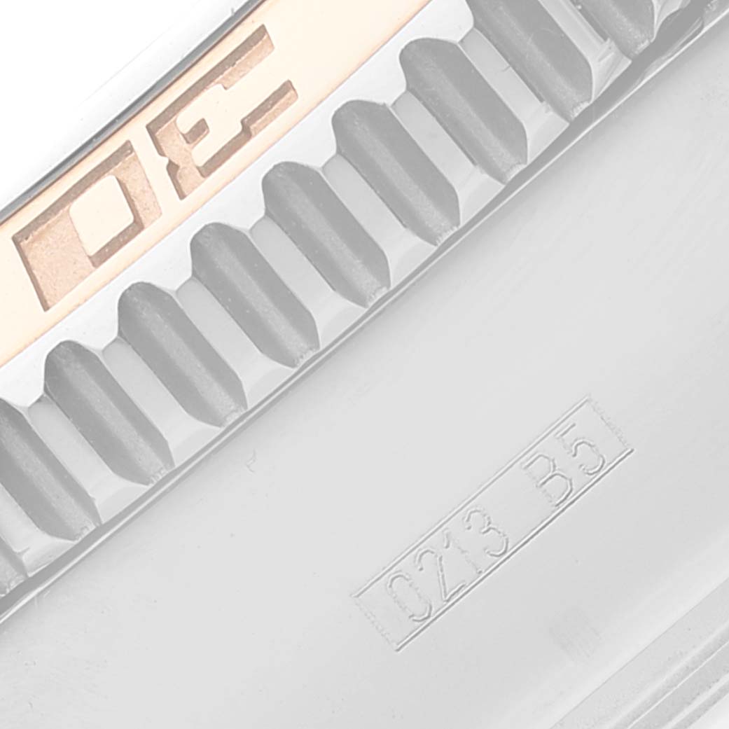 This image shows a close-up of the bezel and part of the band on a Breitling Superocean C13341 Men's Steel and Gold (two tone) Black Dial C13341 Men's Steel and Gold (two tone) Black Dial watch.