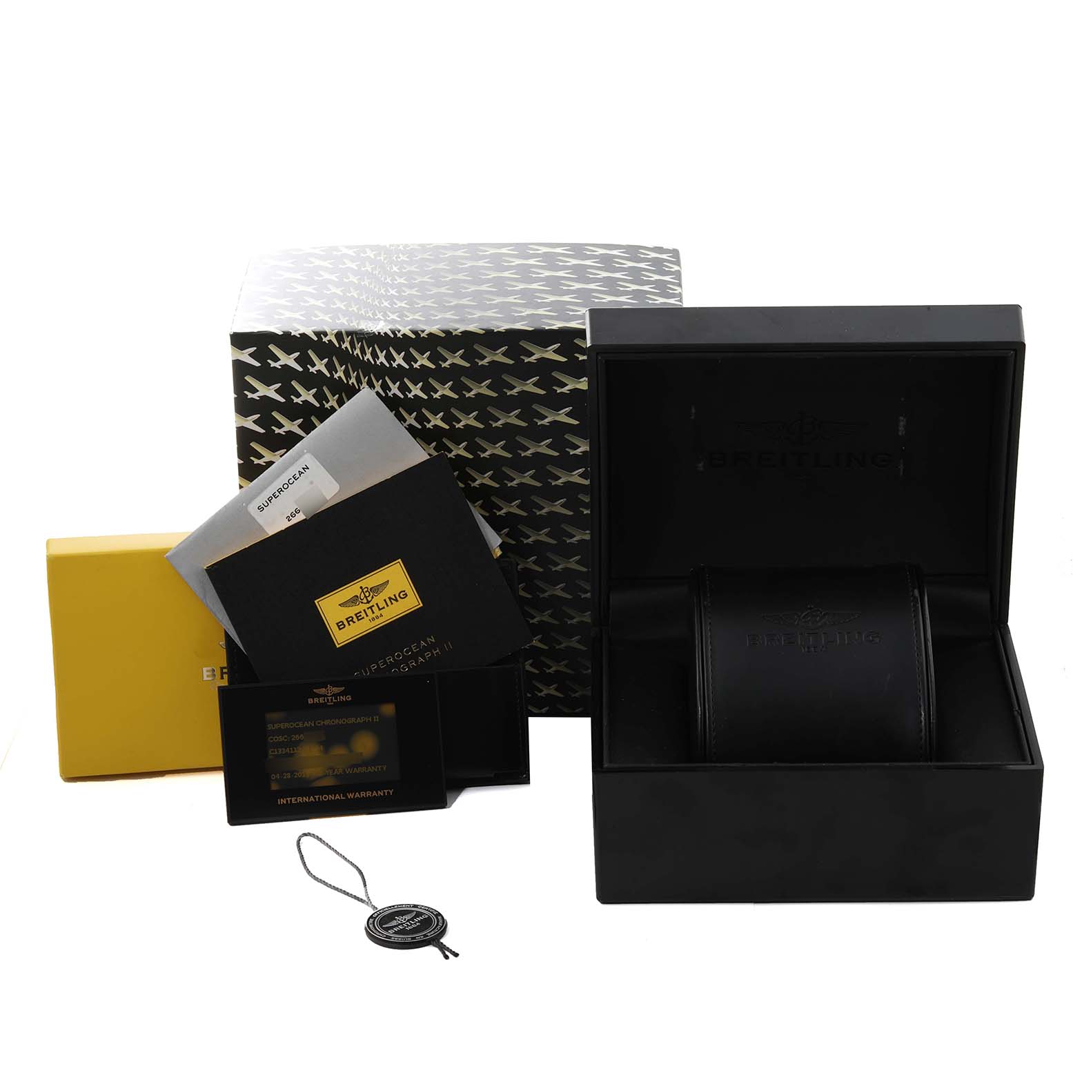 The image shows the packaging and accessories, including the box, warranty, and manuals, for the Breitling Superocean C13341 Men's Steel and Gold (two tone) Black Dial C13341 Men's Steel and Gold (two tone) Black Dial watch model.