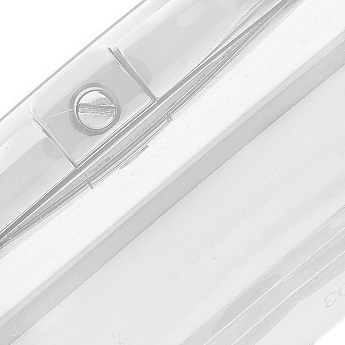 The image shows a close-up of a part of the Breitling Chronomat AB0110 Men's Stainless Steel Mother of Pearl Dial AB0110 Men's Stainless Steel Mother of Pearl Dial watch, focusing on the screw securing the bezel.