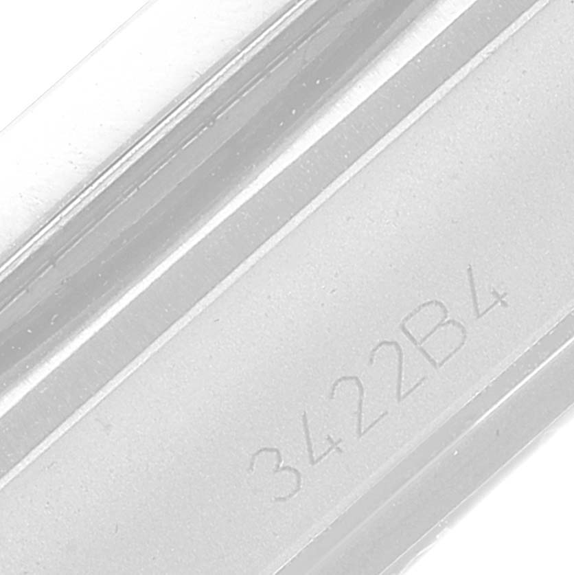 This image shows a close-up of a bracelet or clasp part of a Breitling Chronomat A32398 Men
s Stainless Steel White Dial A32398 Men
s Stainless Steel White Dial watch with the model number "3422B4" engraved.