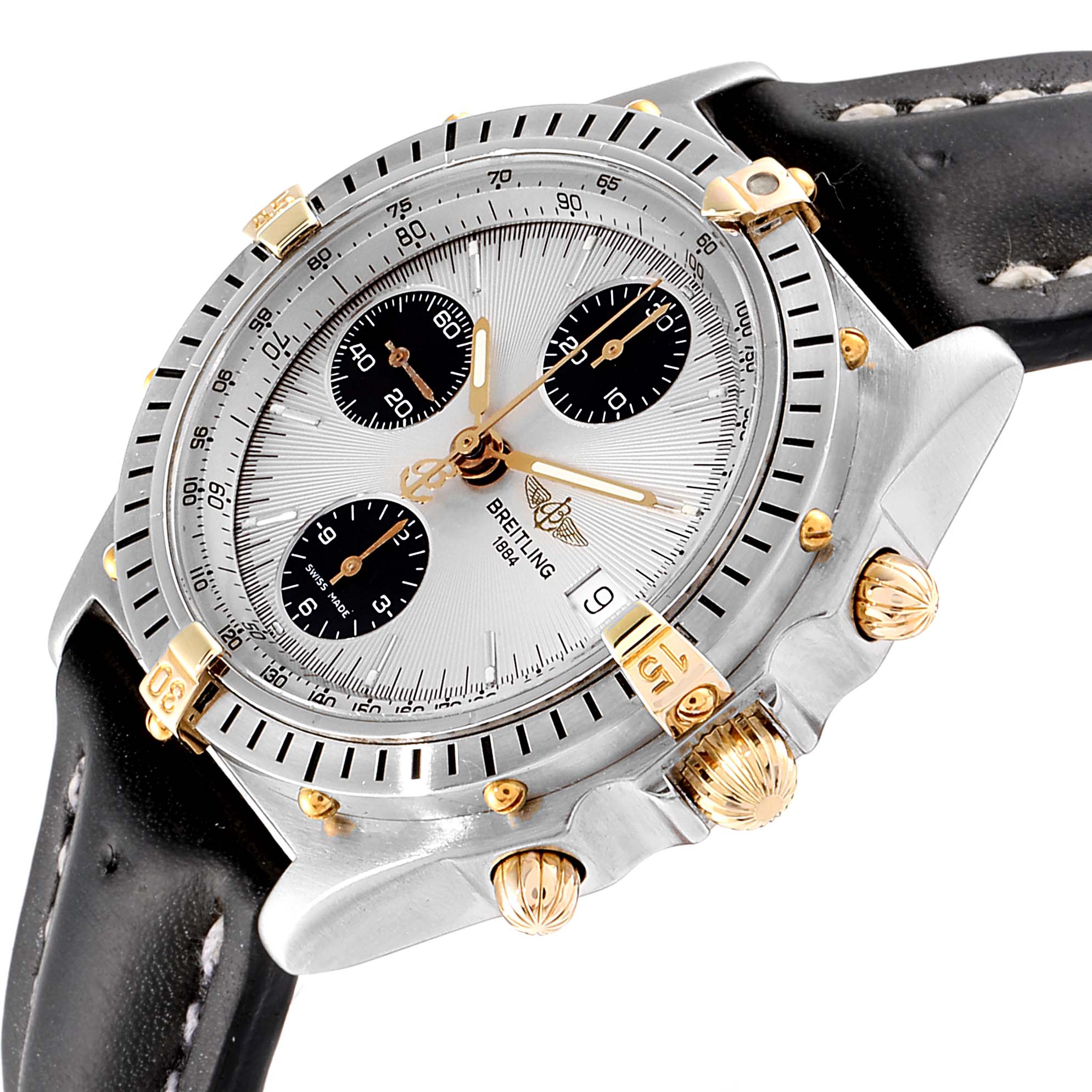 This image shows a Breitling Chronomat B13050 Men's Steel and Gold (two tone) Silver Dial B13050 Men's Steel and Gold (two tone) Silver Dial watch at a slight angle, highlighting its dial, bezel, pushers, and part of the leather strap.