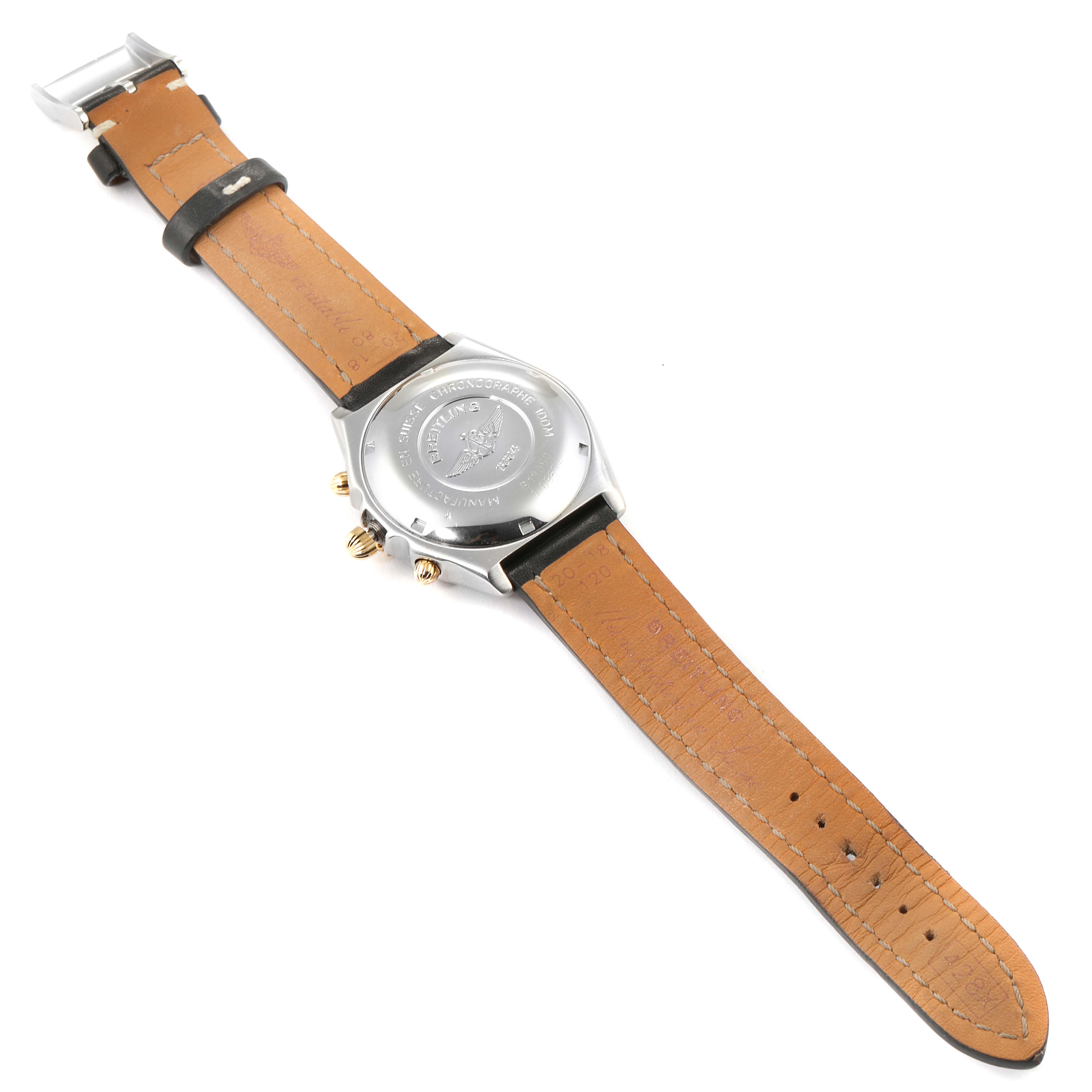 The image shows the backside of the Breitling Chronomat B13050 Men's Steel and Gold (two tone) Silver Dial B13050 Men's Steel and Gold (two tone) Silver Dial watch, displaying the case back and leather strap.