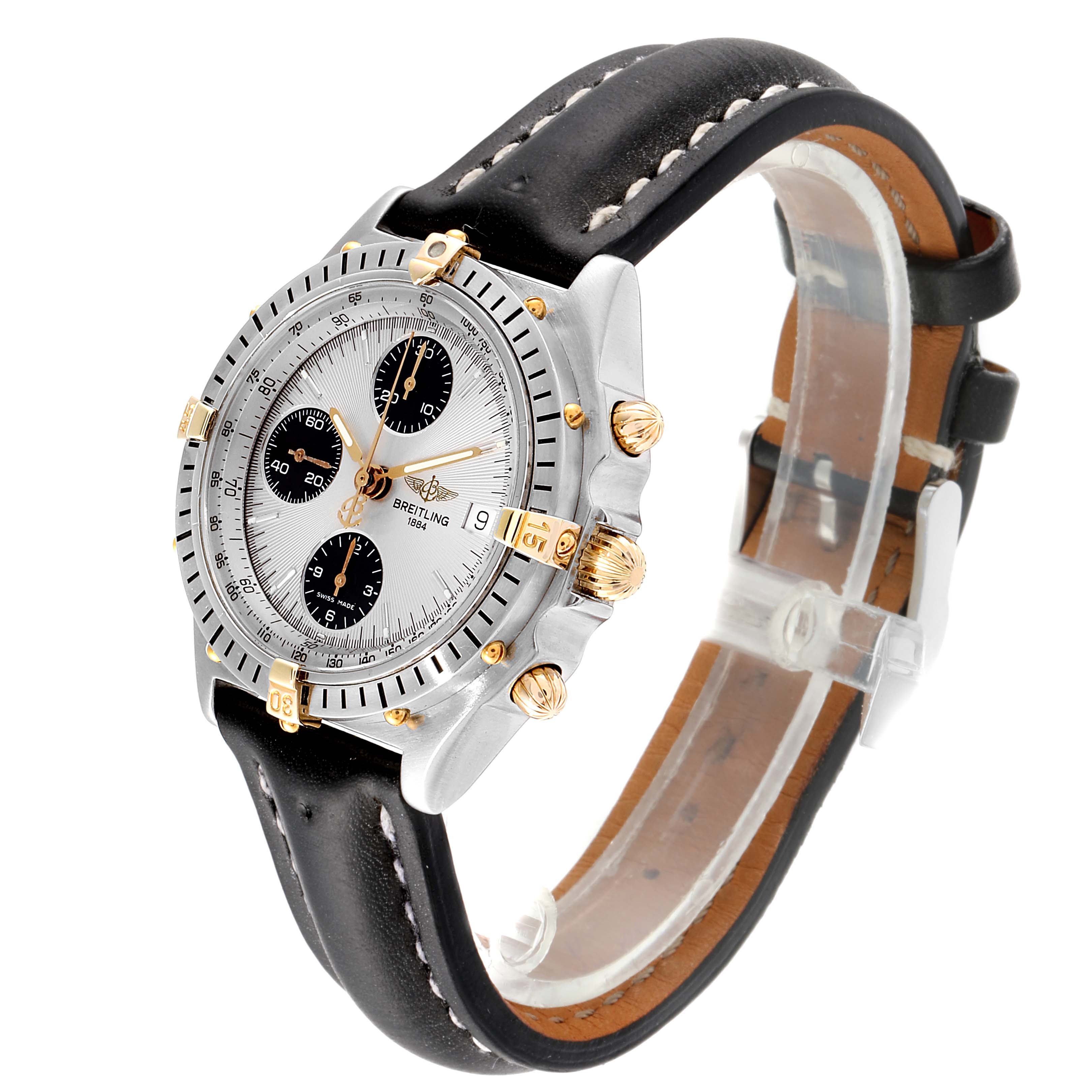 The Breitling Chronomat B13050 Men's Steel and Gold (two tone) Silver Dial B13050 Men's Steel and Gold (two tone) Silver Dial watch is shown at a 3/4 angle, displaying the face, bezel, pushers, crown, and leather strap.