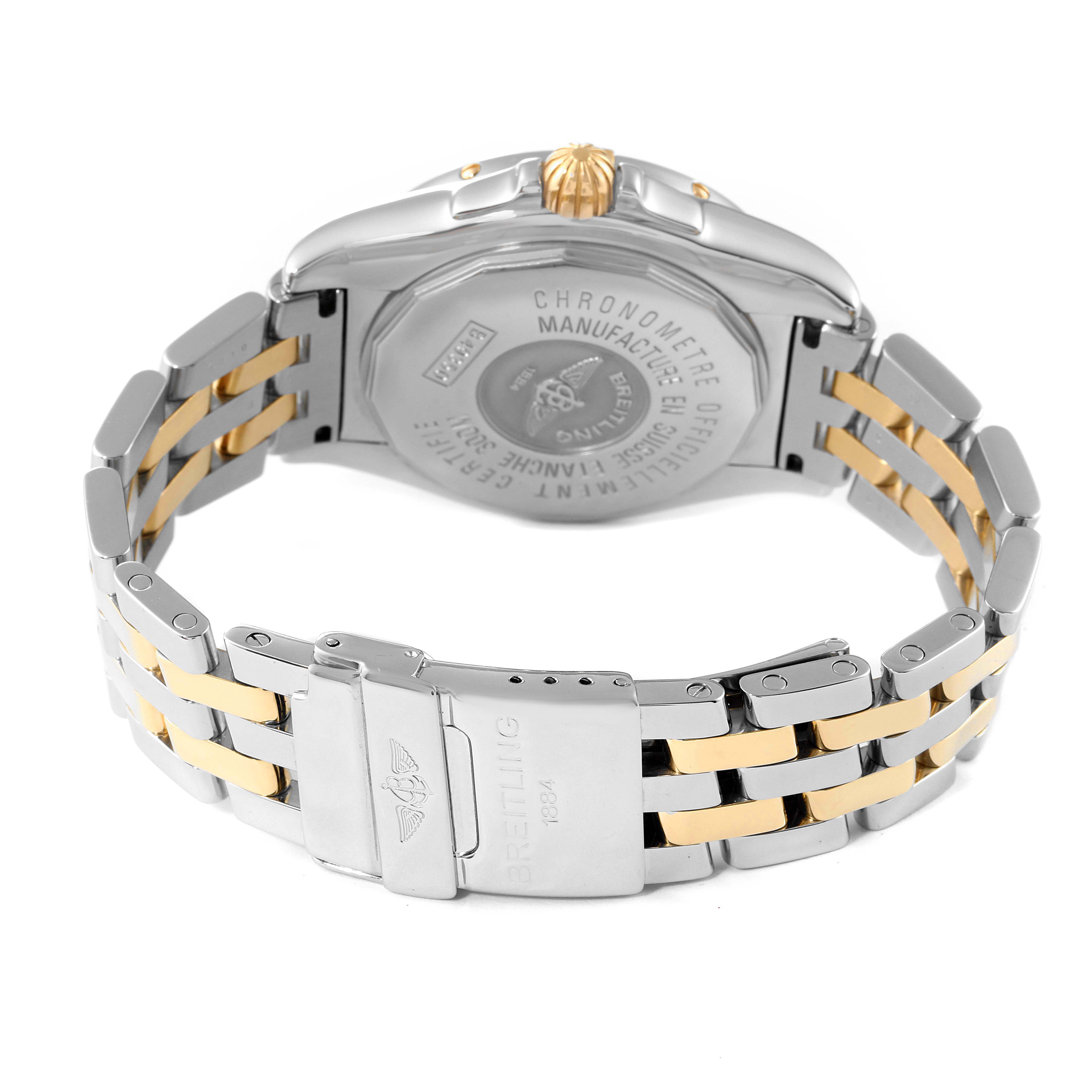 The image shows the back and clasp of the Breitling Windrider B49350 Men's Steel and Gold (two tone) Black Dial B49350 Men's Steel and Gold (two tone) Black Dial watch, highlighting its two-tone metal bracelet and caseback inscriptions.