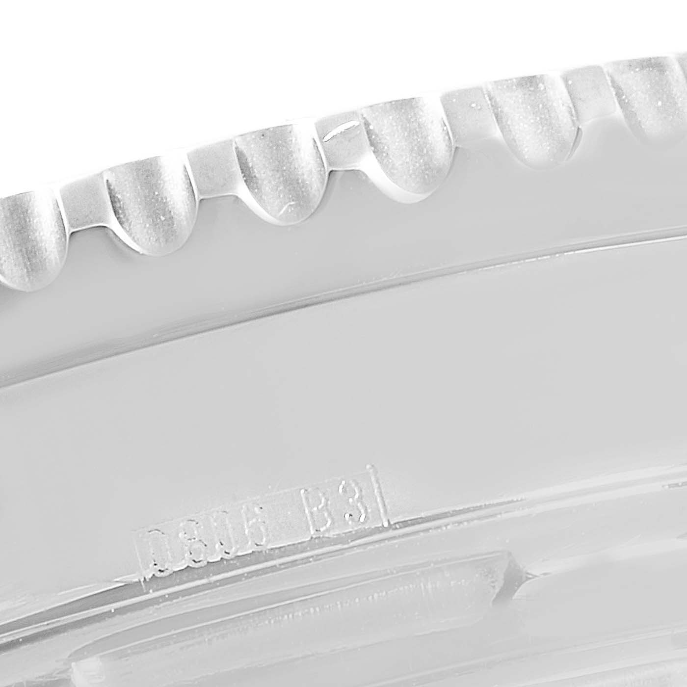 This close-up image showcases the engraved bezel edge and part of the case of a Breitling Navitimer A23322 Men's Stainless Steel Black Dial A23322 Men's Stainless Steel Black Dial watch.